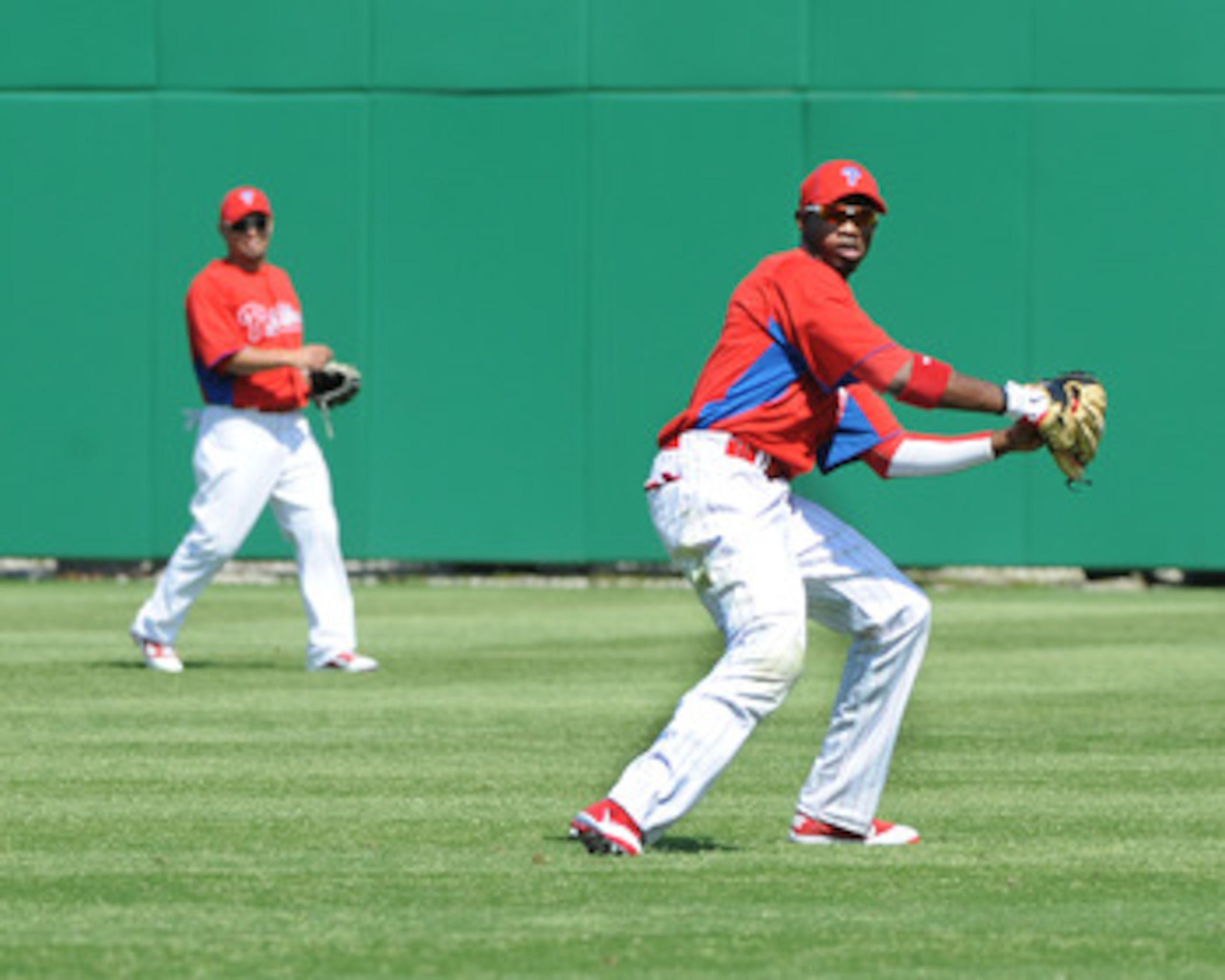 CLEARWATER, FL - FEBRUARY 24:  Outfielder Domonic Brown #9 of the Philadelphia Phillies fields a ball in right field against the Florida State Seminoles February 24, 2011 at Bright House Field in Clearwater, Florida.  (Photo by Al Messerschmidt/Getty Imag