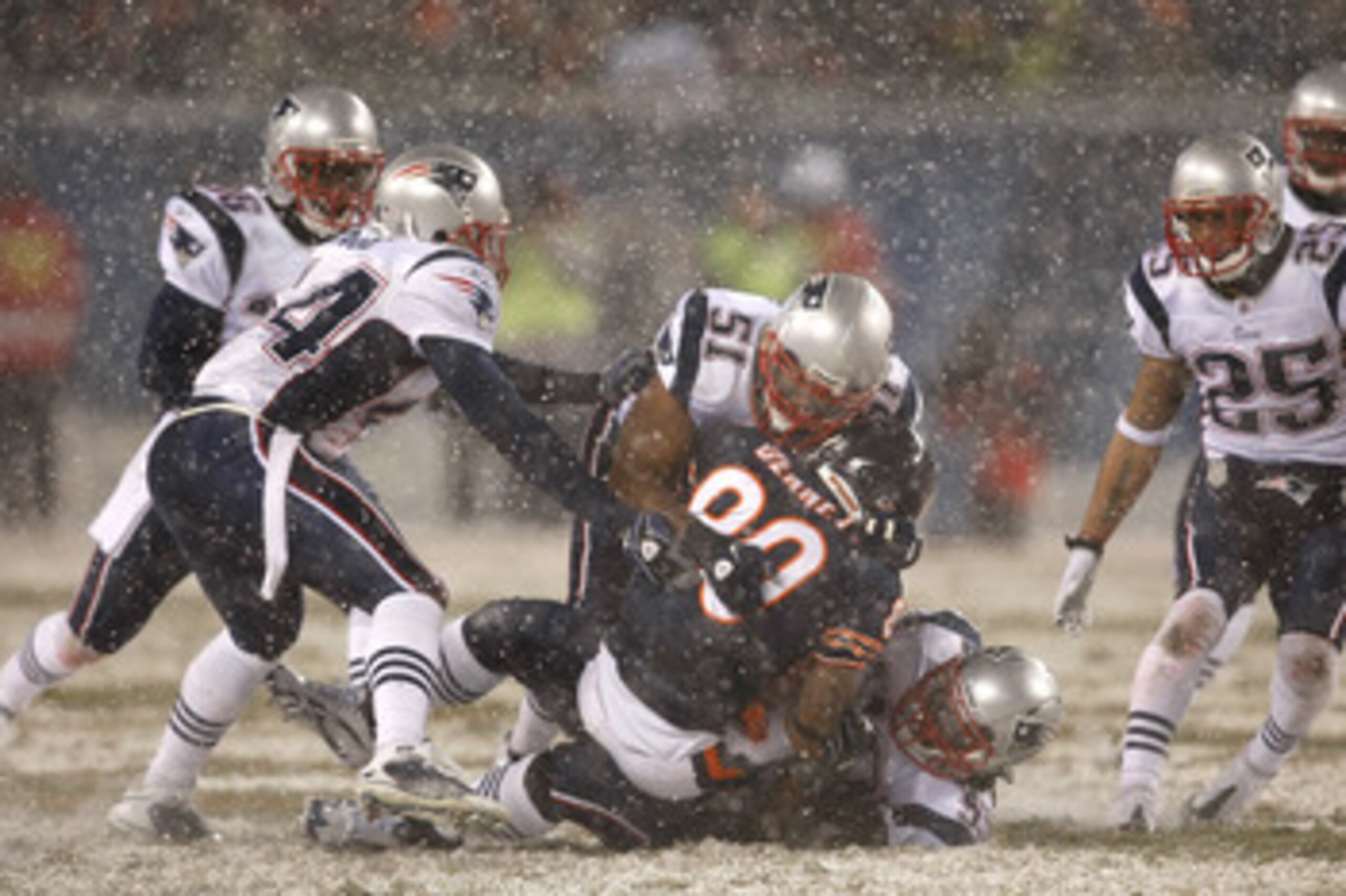 CHICAGO, IL - DECEMBER 12: Jerod Mayo #51 of the New England Patriots tackles Earl Bennett #80 of the Chicago Bears at Soldier Field on December 12, 2010 in Chicago, Illinois. The Patriots defeated the Bears 36-7. (Photo by Scott Boehm/Getty Images)