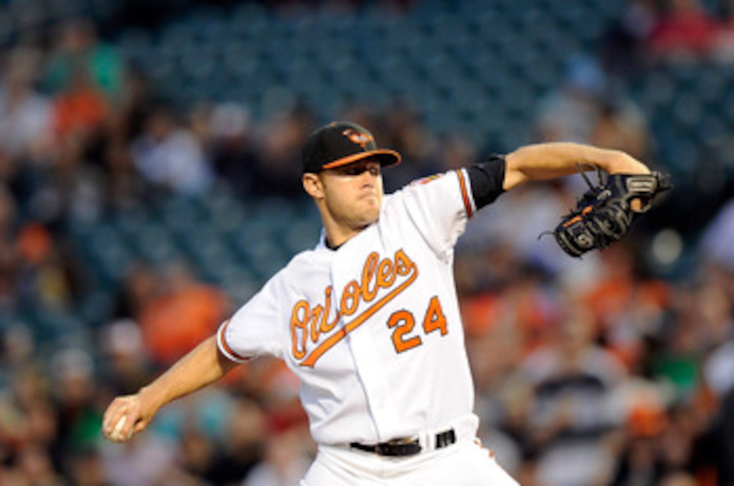 BALTIMORE, MD - APRIL 18:  Chris Tillman #24 of the Baltimore Orioles pitches against the Minnesota Twins at Oriole Park at Camden Yards on April 18, 2011 in Baltimore, Maryland.  (Photo by Greg Fiume/Getty Images)