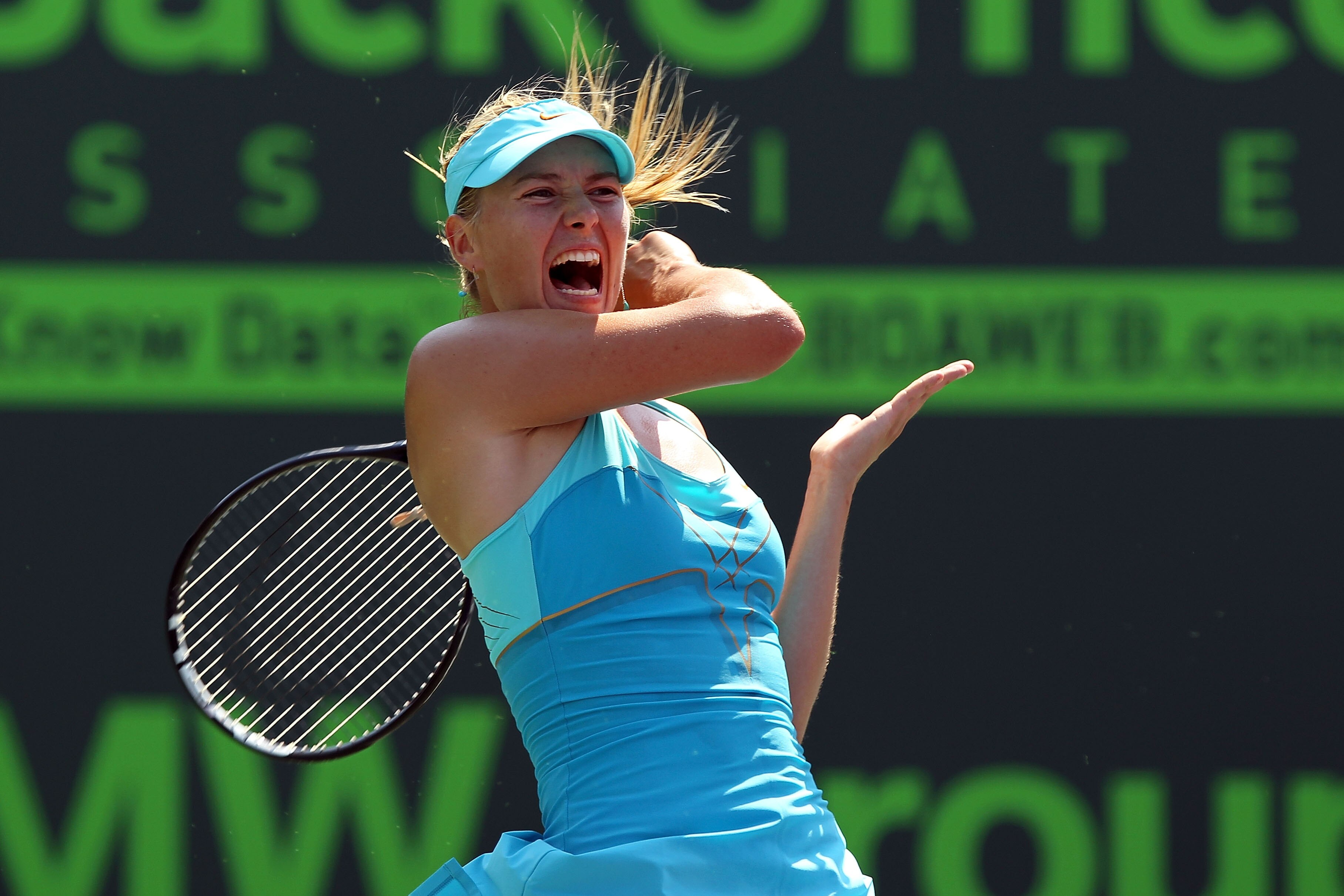 KEY BISCAYNE, FL - MARCH 31:  Maria Sharapova of Russia follows through on a return against Andrea Petkovic of Germany during their women's semifinal match at the Sony Ericsson Open at Crandon Park Tennis Center on March 31, 2011 in Key Biscayne, Florida.