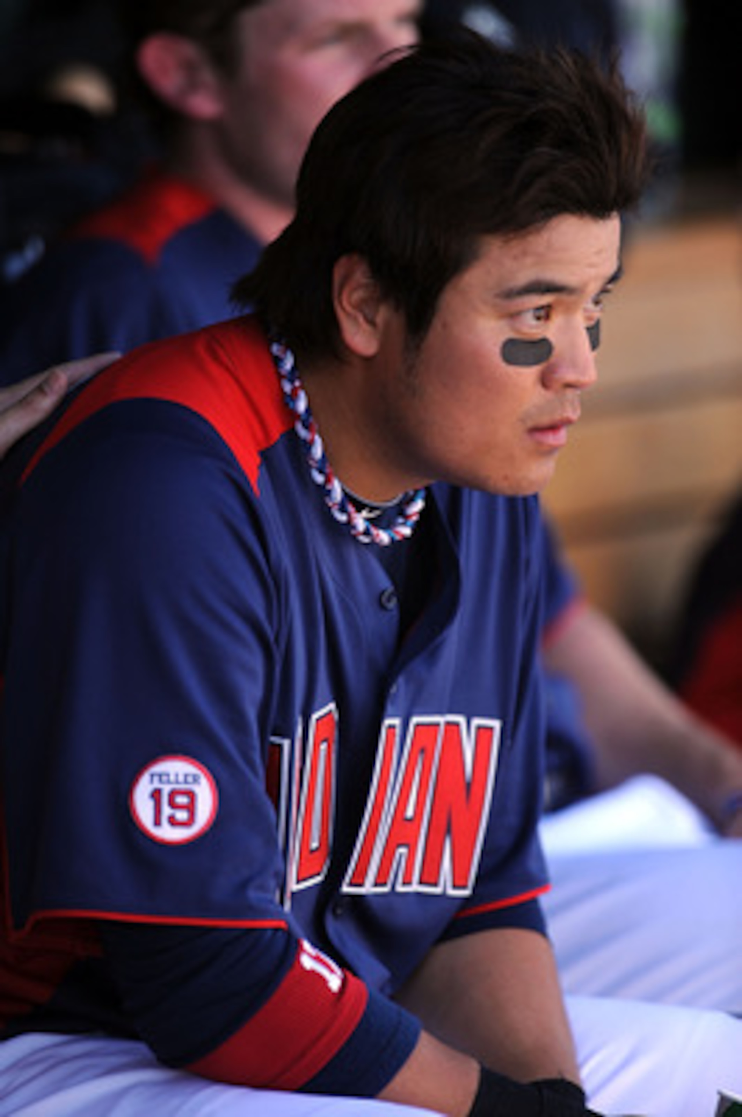 GOODYEAR, AZ - MARCH 11:  Shin-Soo Choo #17 of the Cleveland Indians sits in the dugout between innings against the Seattle Mariners at Goodyear Ballpark on March 11, 2011 in Goodyear, Arizona.  (Photo by Norm Hall/Getty Images)