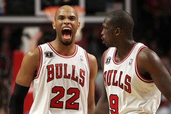 CHICAGO, IL - MAY 15:  (L-R) Taj Gibson #22 and Luol Deng #9 of the Chicago Bulls celebrate a play against the Miami Heat in Game One of the Eastern Conference Finals during the 2011 NBA Playoffs on May 15, 2011 at the United Center in Chicago, Illinois.