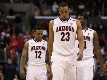 LOS ANGELES, CA - MARCH 12: Derrick Williams #23 of the Arizona Wildcats walks ahead of teammates Lamont Jones #12 and Solomon Hill #44 while taking on the Washington Huskies in the championship game of the 2011 Pacific Life Pac-10 Men's Basketball Tourn LOS ANGELES, CA - MARCH 12: Derrick Williams #23 of the Arizona Wildcats walks ahead of teammates Lamont Jones #12 and Solomon Hill #44 while taking on the Washington Huskies in the championship game of the 2011 Pacific Life Pac-10 Men's Basketball Tourn