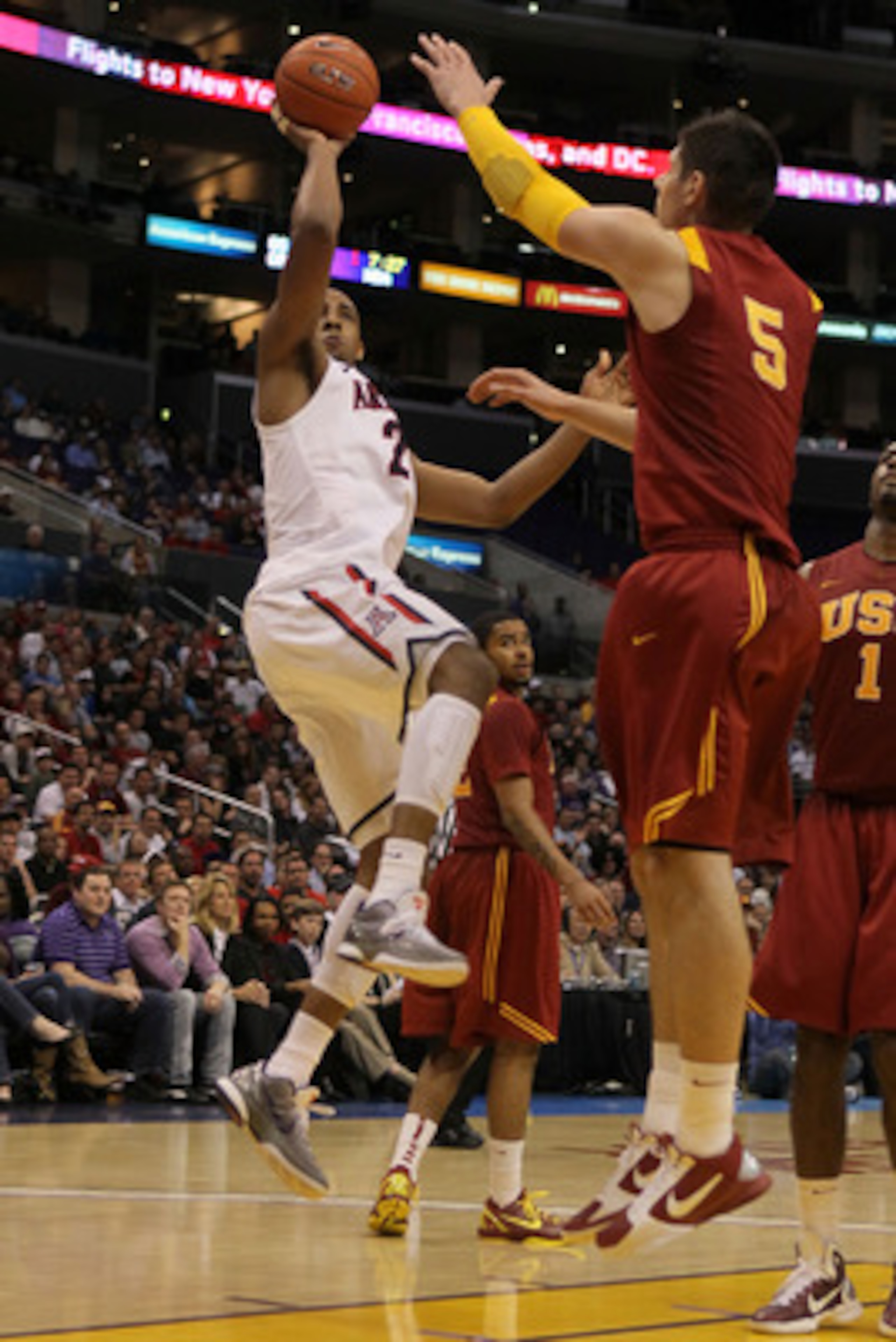 LOS ANGELES, CA - MARCH 11:  Derrick Williams #23 of the Arizona Wildcats shoots the ball over Nikola Vucevic #5 of the USC Trojans in the second half in the semifinals of the 2011 Pacific Life Pac-10 Men's Basketball Tournament at Staples Center on March