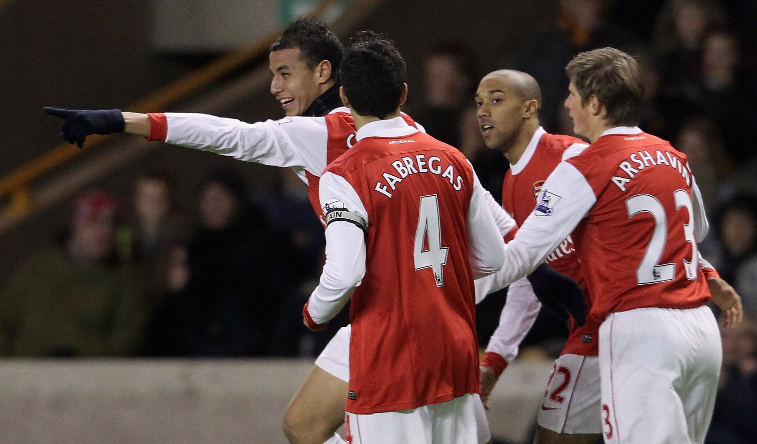 WOLVERHAMPTON, ENGLAND - NOVEMBER 10: Marouane Chamakh of Arsenal (L) celebrates after scoring their first goal during the Barclays Premier League match between Wolverhampton Wanderers and Arsenal, at Molineux on November 10, 2010 in Wolverhampton, Englan
