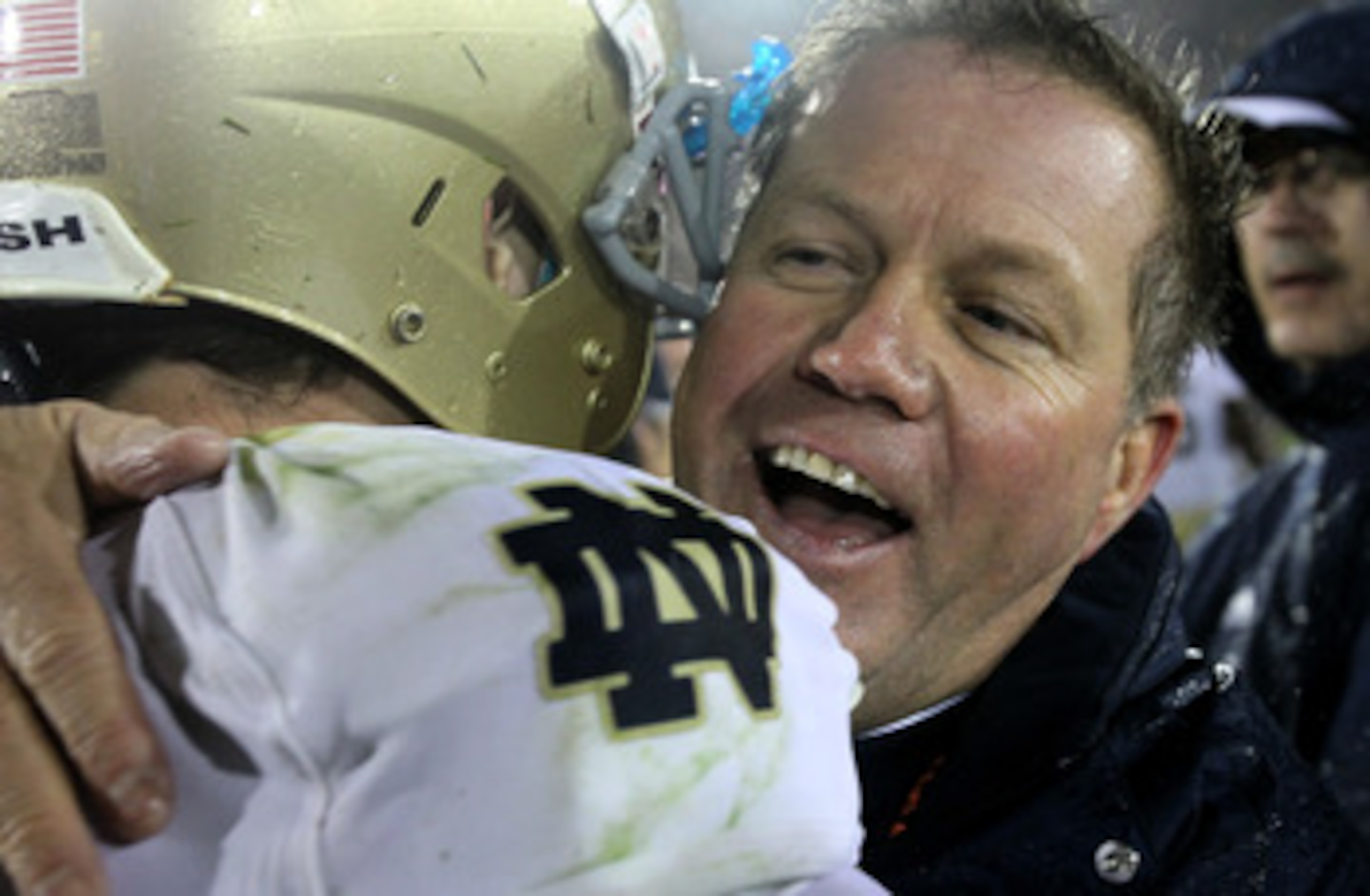 LOS ANGELES, CA - NOVEMBER 27:  Head coach Brian Kelly and quarterback Tommy Rees #13 of the Notre Dame Fighting Irish embrace after the game against the USC Trojans at the Los Angeles Memorial Coliseum on November 27, 2010 in Los Angeles, California.  No