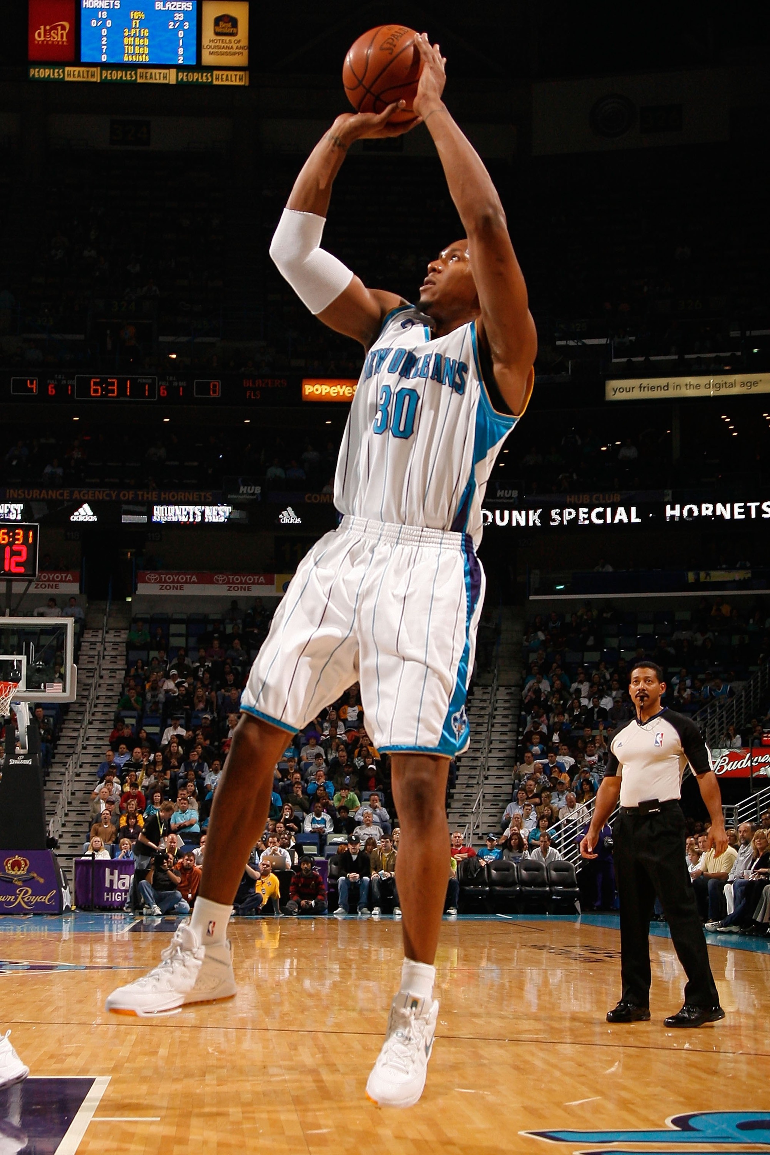 NEW ORLEANS - NOVEMBER 13: David West #30 of the New Orleans Hornets shoots the ball against the Portland Trail Blazers at the New Orleans Arena on November 13, 2009 in New Orleans, Louisiana. NOTE TO USER: User expressly acknowledges and agrees that, b NEW ORLEANS - NOVEMBER 13: David West #30 of the New Orleans Hornets shoots the ball against the Portland Trail Blazers at the New Orleans Arena on November 13, 2009 in New Orleans, Louisiana. NOTE TO USER: User expressly acknowledges and agrees that, b