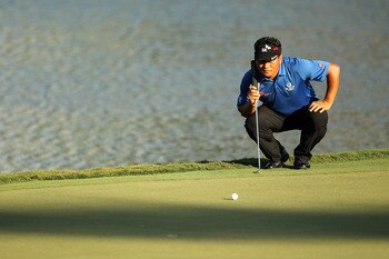 PONTE VEDRA BEACH, FL - MAY 15:  K.J. Choi of South Korea lines up a putt 17th hole during the final round of THE PLAYERS Championship held at THE PLAYERS Stadium course at TPC Sawgrass on May 15, 2011 in Ponte Vedra Beach, Florida.  (Photo by Mike Ehrman