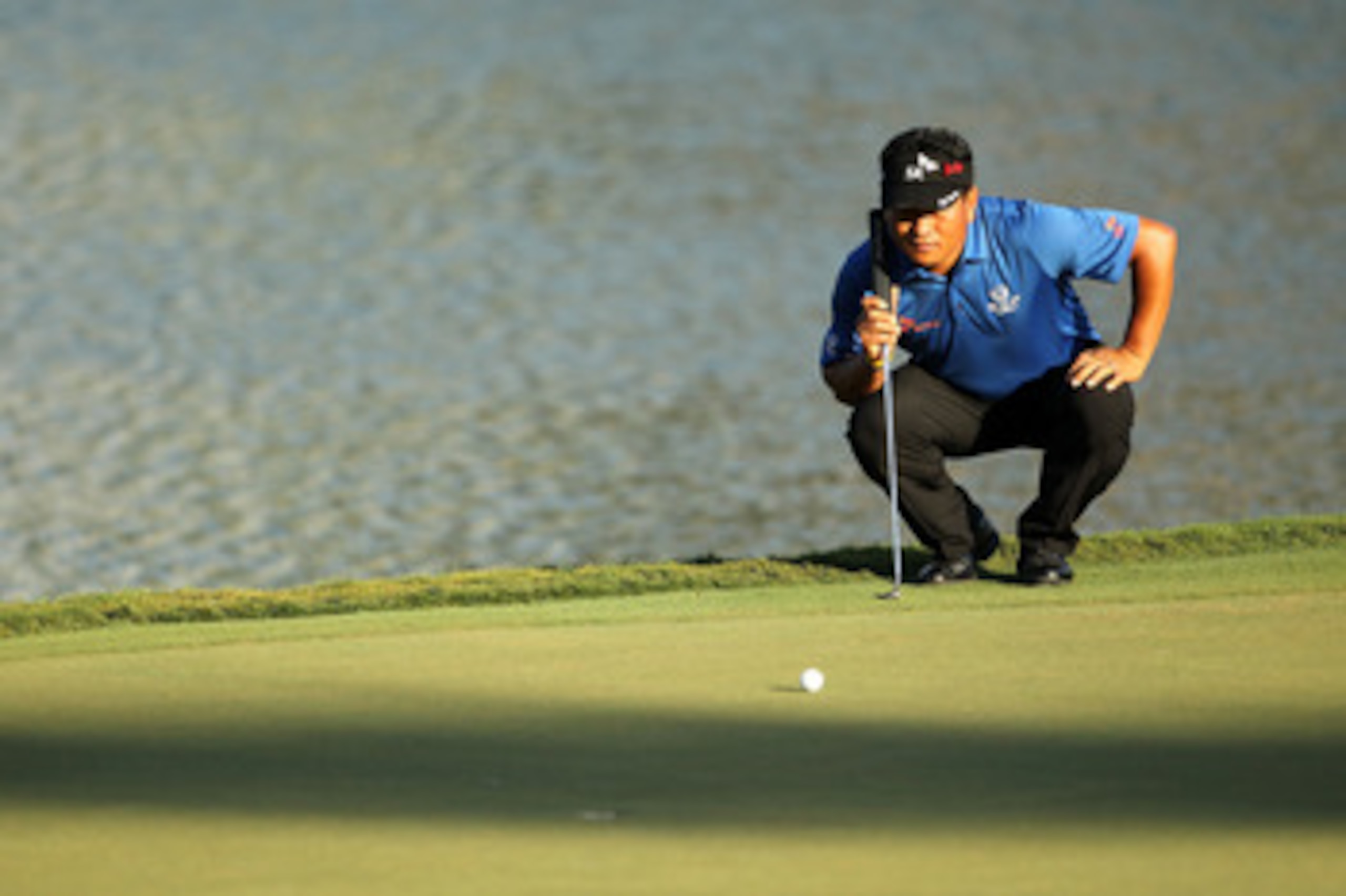 PONTE VEDRA BEACH, FL - MAY 15: K.J. Choi of South Korea lines up a putt 17th hole during the final round of THE PLAYERS Championship held at THE PLAYERS Stadium course at TPC Sawgrass on May 15, 2011 in Ponte Vedra Beach, Florida. (Photo by Mike Ehrman PONTE VEDRA BEACH, FL - MAY 15: K.J. Choi of South Korea lines up a putt 17th hole during the final round of THE PLAYERS Championship held at THE PLAYERS Stadium course at TPC Sawgrass on May 15, 2011 in Ponte Vedra Beach, Florida. (Photo by Mike Ehrman