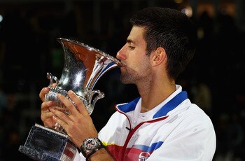ROME, ITALY - MAY 15:  Novak Djokovic of Serbia kisses the trophy after his victory in the final against Rafael Nadal of Spain during day eight of the Internazoinali BNL D'Italia at the Foro Italico Tennis Centre on May 15, 2011 in Rome, Italy.  (Photo by