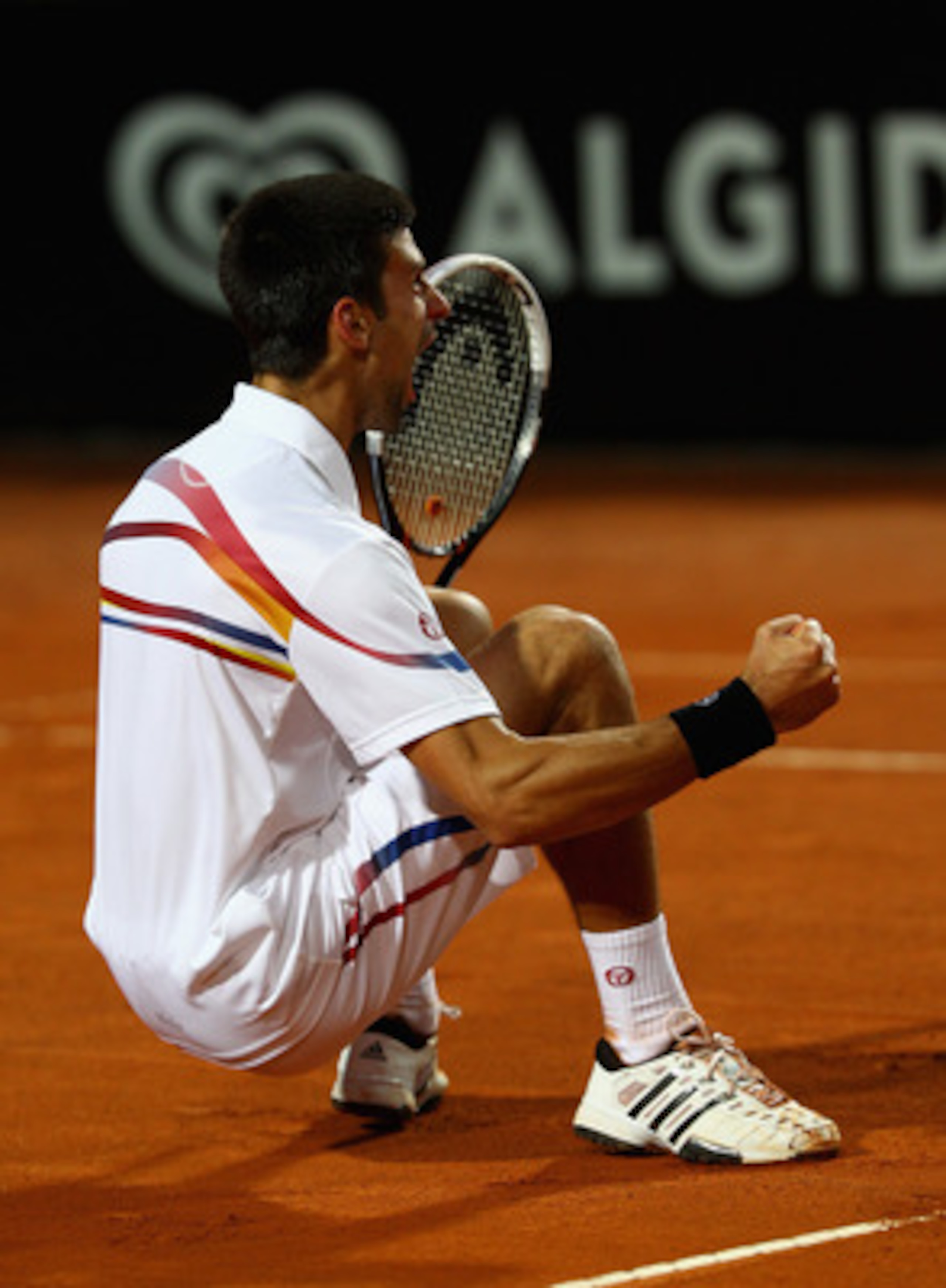 ROME, ITALY - MAY 15: Novak Djokovic of Serbia celebrates match point during the final against Rafael Nadal of Spain during day eight of the Internazoinali BNL D'Italia at the Foro Italico Tennis Centre on May 15, 2011 in Rome, Italy. (Photo by Clive Br ROME, ITALY - MAY 15: Novak Djokovic of Serbia celebrates match point during the final against Rafael Nadal of Spain during day eight of the Internazoinali BNL D'Italia at the Foro Italico Tennis Centre on May 15, 2011 in Rome, Italy. (Photo by Clive Br