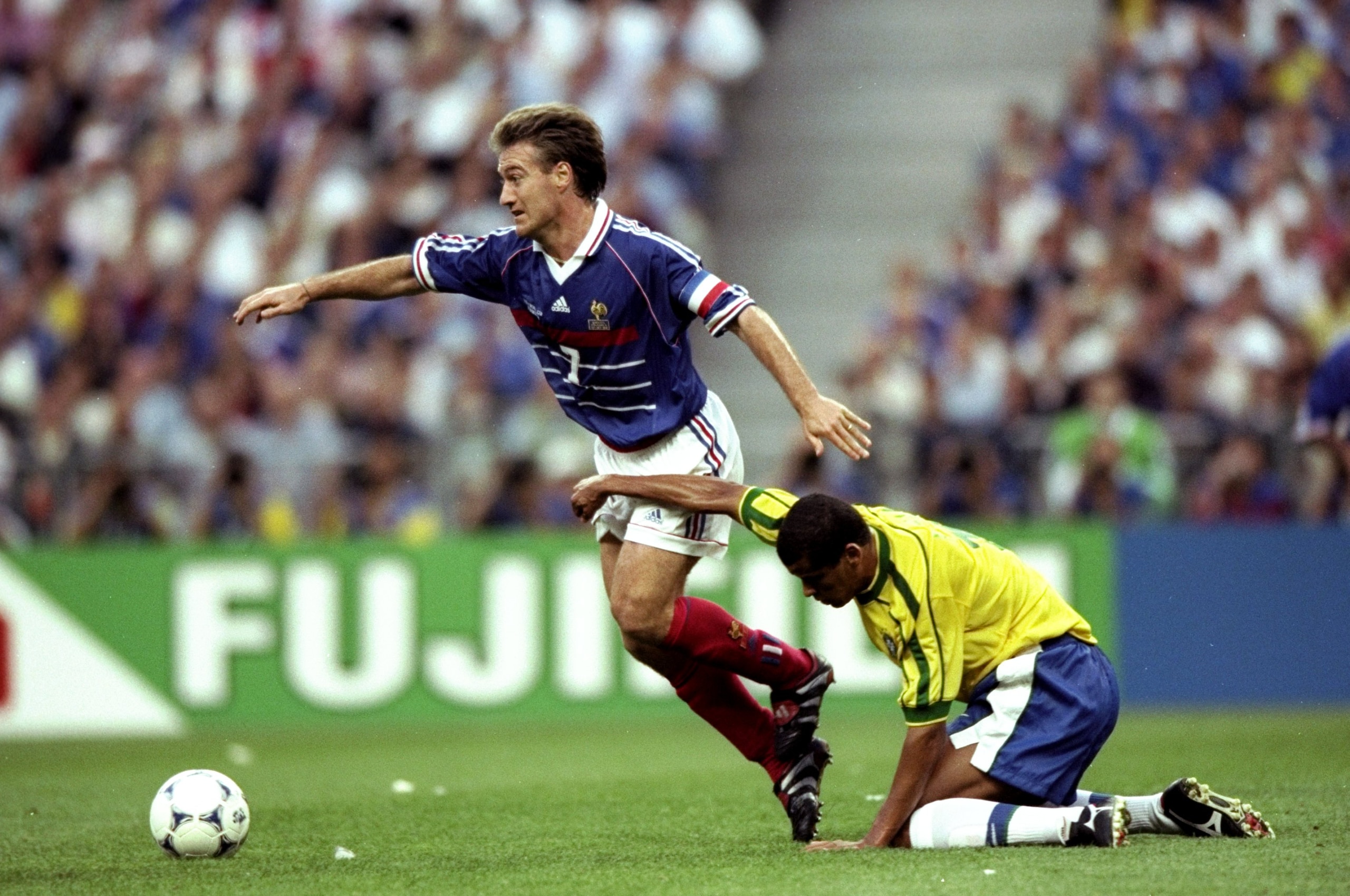 12 Jul 1998:  France captain Didier Deschamps is held as he goes past Rivaldo of Brazil during the World Cup Final at the Stade de France in St Denis. France won 3-0.  \ Mandatory Credit: Shaun Botterill /Allsport
