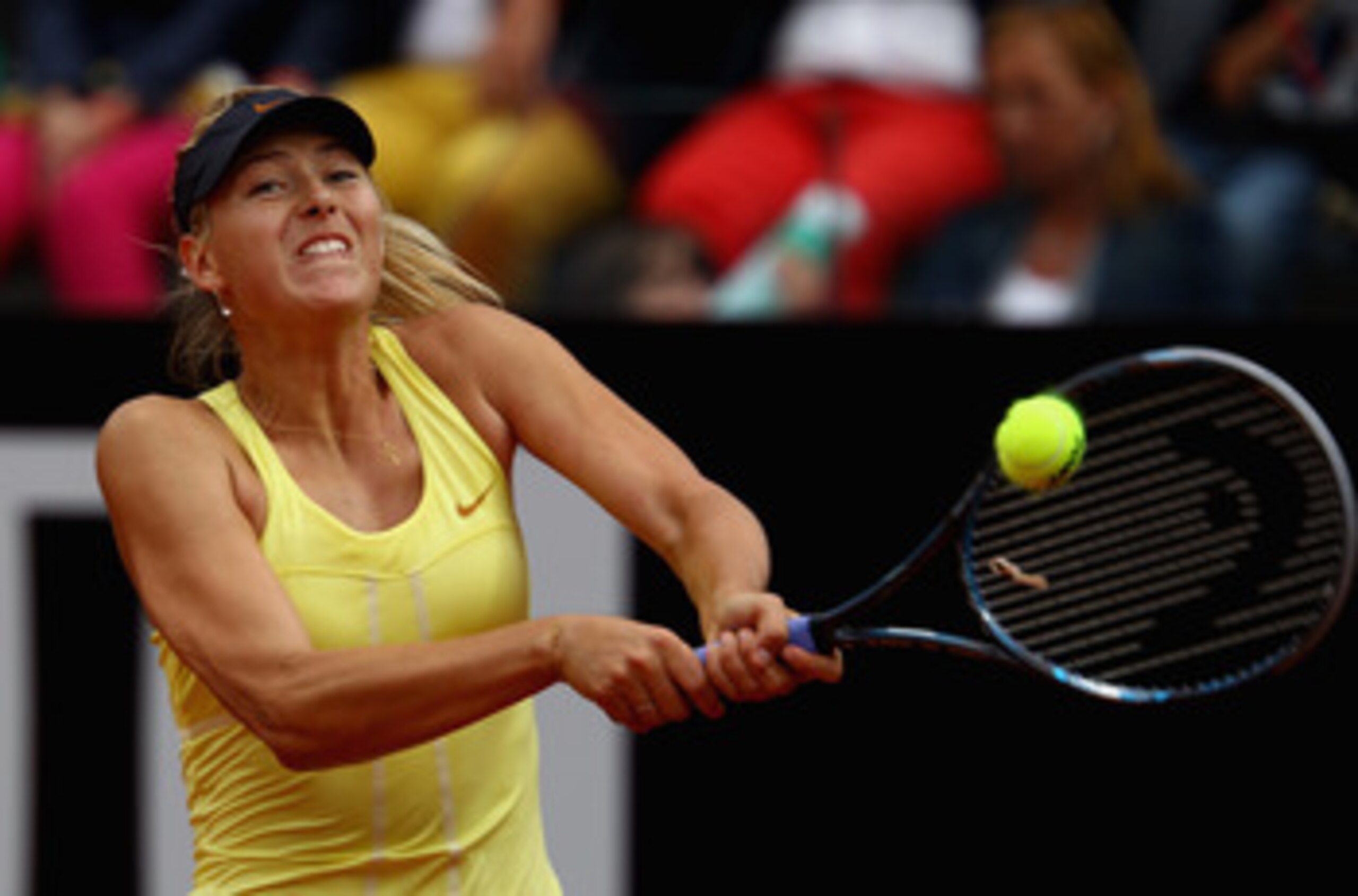 ROME, ITALY - MAY 15:  Maria Sharapova of Russia plays a backhand during the final against Samantha Stosur of Australia during day eight of the Internazoinali BNL D'Italia at the Foro Italico Tennis Centre on May 15, 2011 in Rome, Italy.  (Photo by Clive 