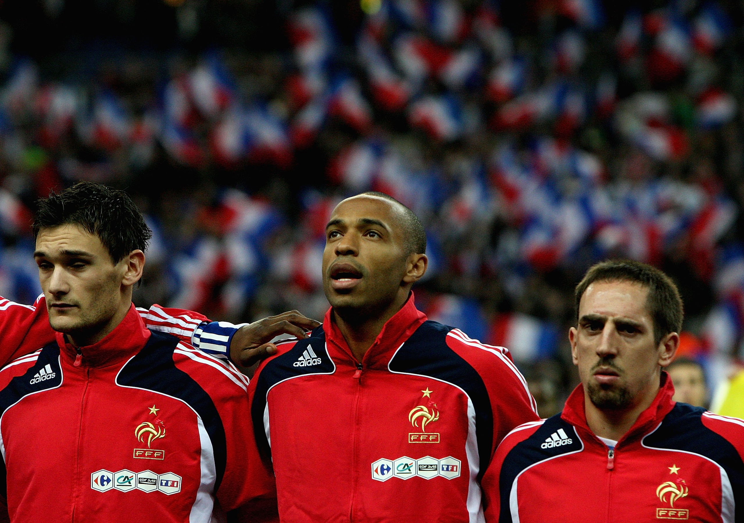 PARIS - NOVEMBER 19:  Thierry Henry (C) of France looks on with team mates during the national anthems ahead of the International Friendly between France and Uruguay at the Stade de France on November 19, 2008 in Paris, France.  (Photo by Hamish Blair/Get