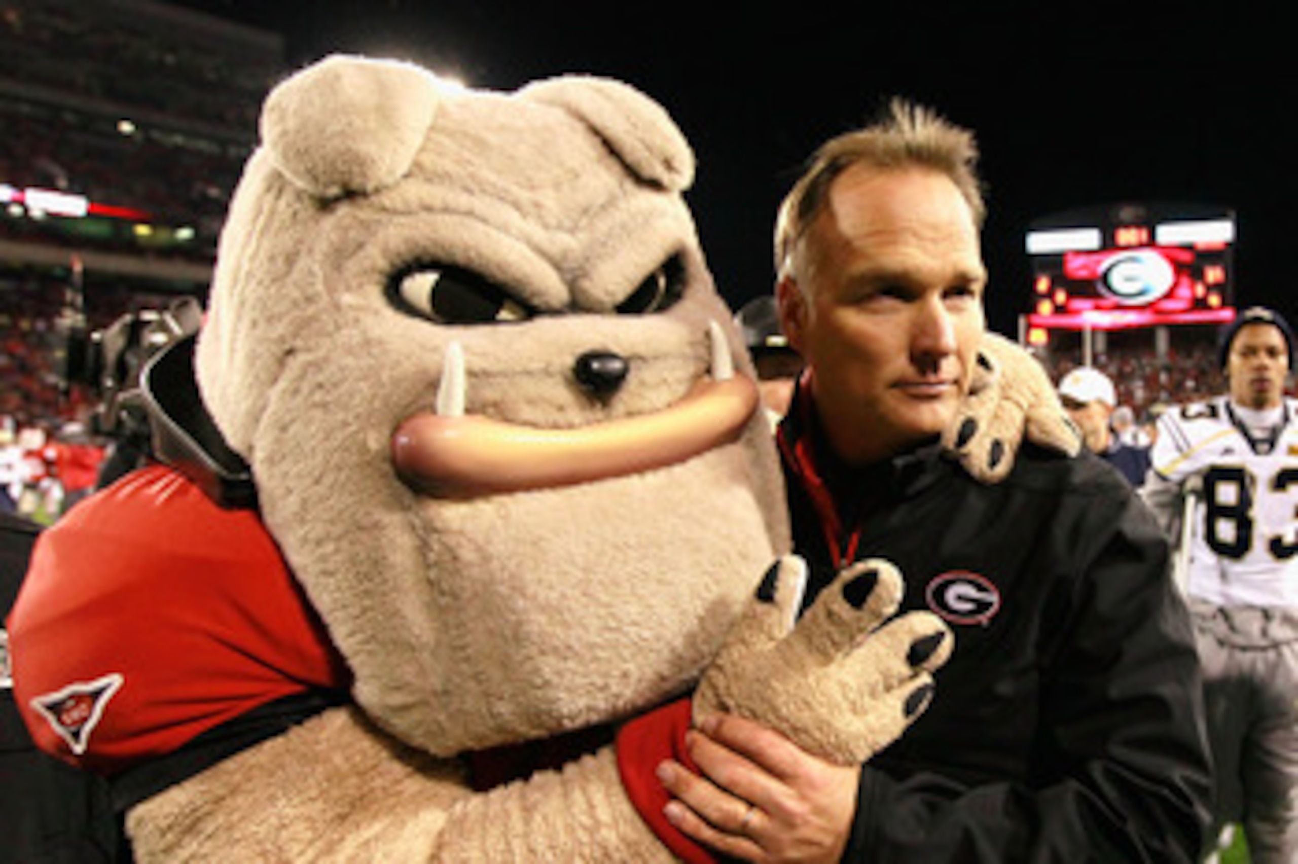 ATHENS, GA - NOVEMBER 27:  Head coach Mark Richt and Hairy, mascot of the Georgia Bulldogs, celebrate their 42-34 win over the Georgia Tech Yellow Jackets at Sanford Stadium on November 27, 2010 in Athens, Georgia.  (Photo by Kevin C. Cox/Getty Images)