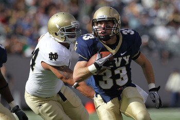 EAST RUTHERFORD, NJ - OCTOBER 23: John Howell #33 of the Navy Midshipmen rushes against the Notre Dame Fighting Irish at New Meadowlands Stadium on October 23, 2010 in East Rutherford, New Jersey.  (Photo by Nick Laham/Getty Images)