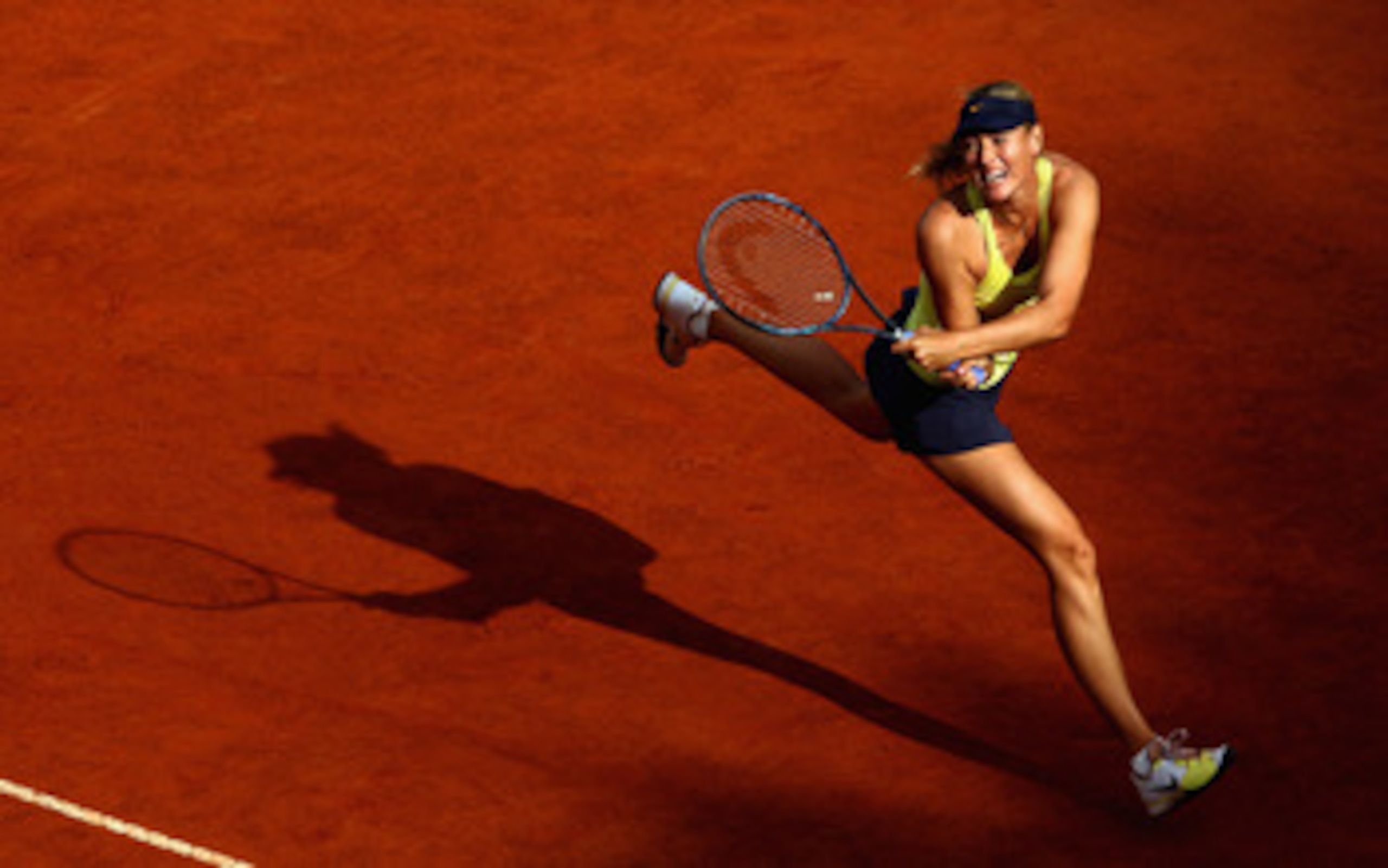 ROME, ITALY - MAY 15: Maria Sharapova of Russia in action during the final against Samantha Stosur of Australia during day eight of the Internazoinali BNL D'Italia at the Foro Italico Tennis Centre on May 15, 2011 in Rome, Italy. (Photo by Clive Brunski ROME, ITALY - MAY 15: Maria Sharapova of Russia in action during the final against Samantha Stosur of Australia during day eight of the Internazoinali BNL D'Italia at the Foro Italico Tennis Centre on May 15, 2011 in Rome, Italy. (Photo by Clive Brunski