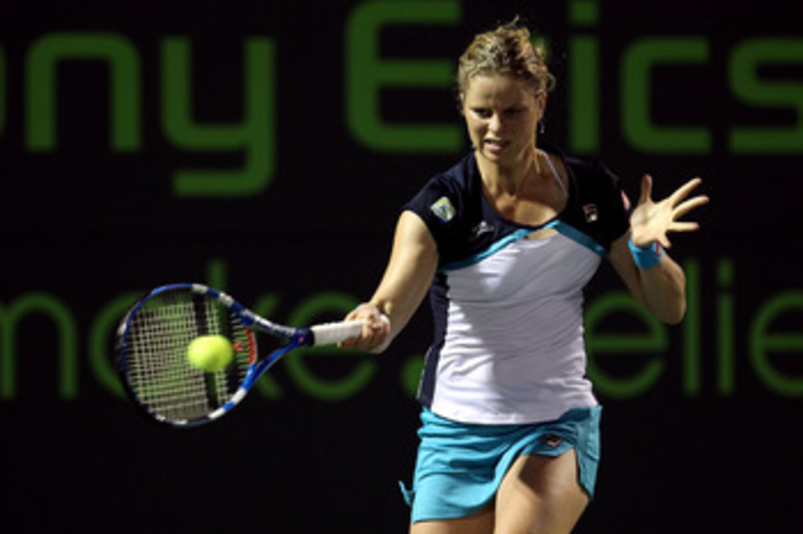KEY BISCAYNE, FL - MARCH 30:  Kim Clijsters of Belgium hits a forehand return against Victoria Azarenka of Belarus during the Sony Ericsson Open at Crandon Park Tennis Center on March 30, 2011 in Key Biscayne, Florida.  (Photo by Al Bello/Getty Images)