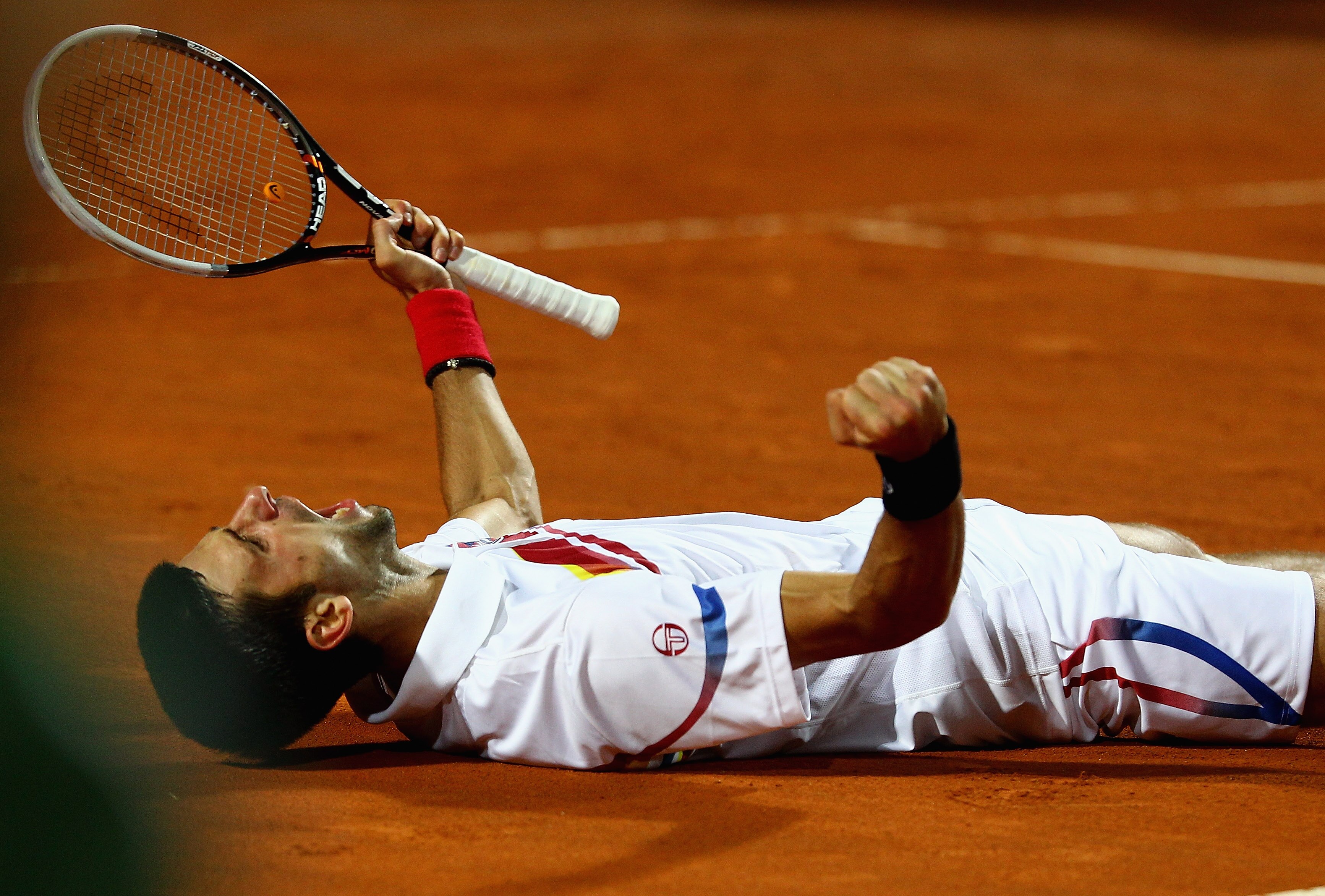 ROME, ITALY - MAY 15: Novak Djokovic of Serbia celebrates match point during the final against Rafael Nadal of Spain during day eight of the Internazoinali BNL D'Italia at the Foro Italico Tennis Centre on May 15, 2011 in Rome, Italy.  (Photo by Clive Bru