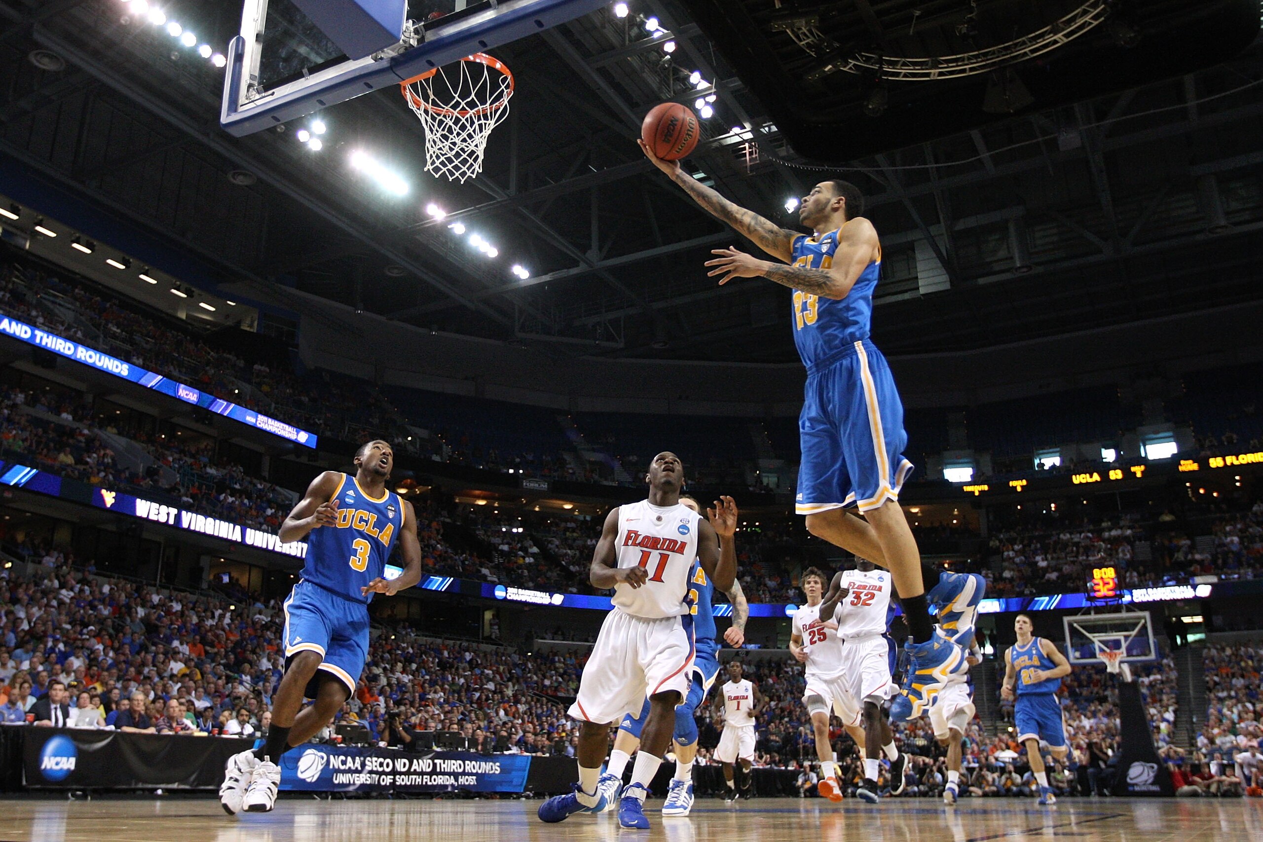 TAMPA, FL - MARCH 19:  Tyler Honeycutt #23 of the UCLA Bruins drives for a shot attempt against the Florida Gators during the third round of the 2011 NCAA men's basketball tournament at St. Pete Times Forum on March 19, 2011 in Tampa, Florida.  (Photo by