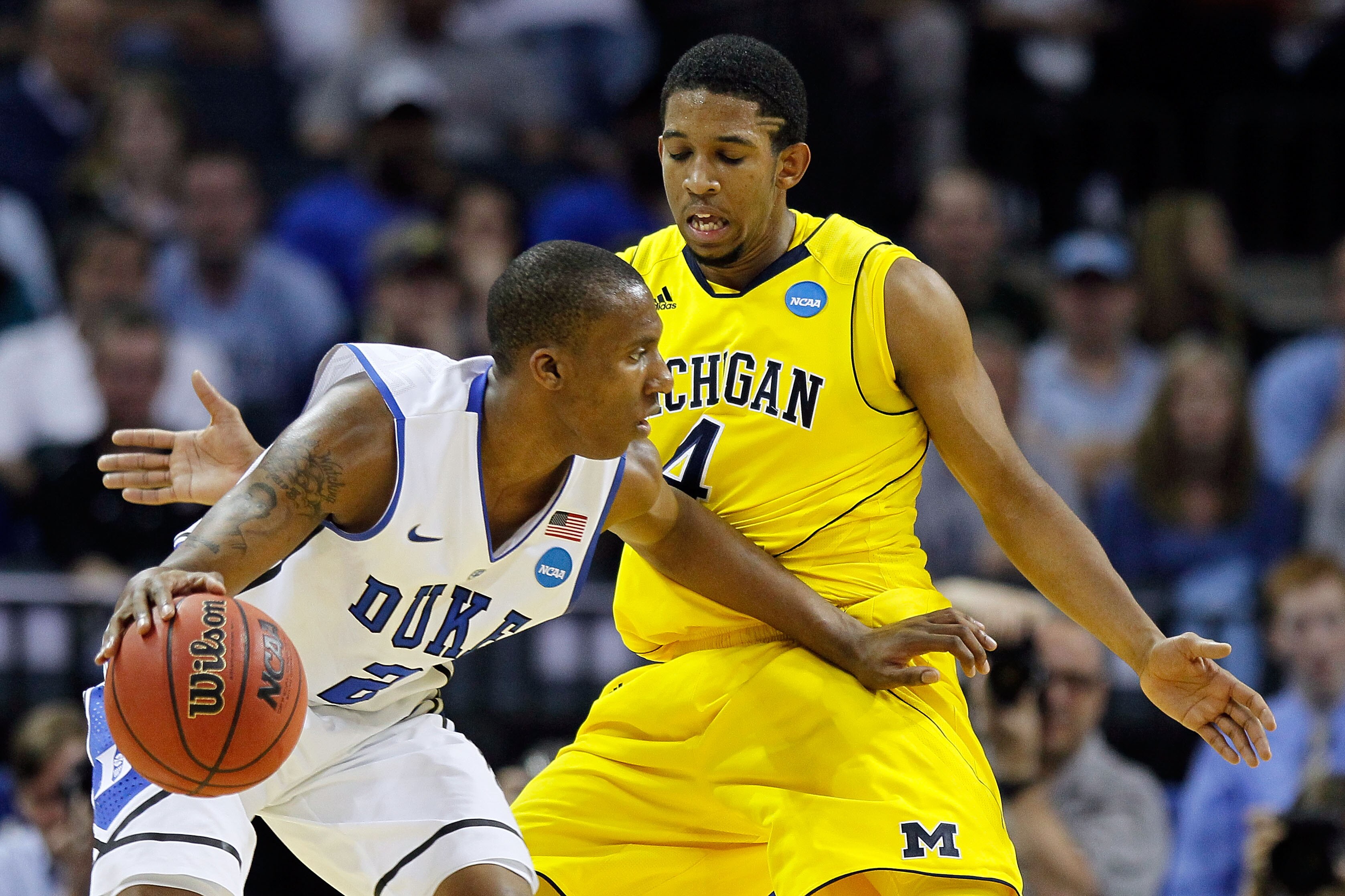 CHARLOTTE, NC - MARCH 20:  Nolan Smith #2 of the Duke Blue Devils moves the ball against Darius Morris #4 of the Michigan Wolverines during the third round of the 2011 NCAA men's basketball tournament at Time Warner Cable Arena on March 20, 2011 in Charlo