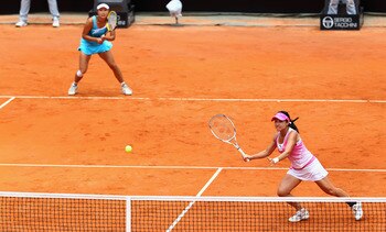 ROME, ITALY - MAY 15:  Shuai Peng and Jie Zheng of China in action during the doubles final against Vania King of the USA and Yaroslava Shvedova of Kazakstan during day eight of the Internazoinali BNL D'Italia at the Foro Italico Tennis Centre on May 15,
