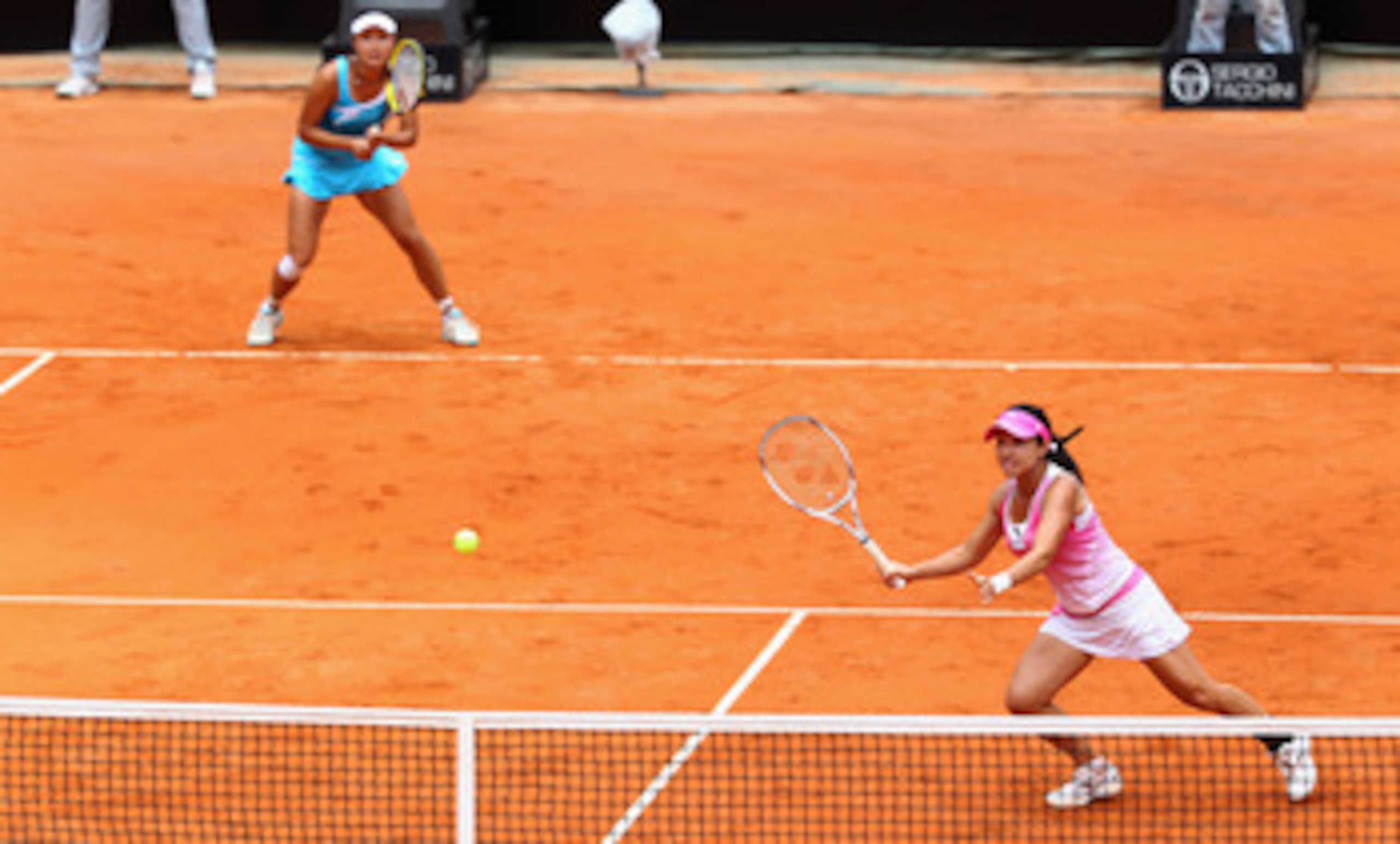 ROME, ITALY - MAY 15: Shuai Peng and Jie Zheng of China in action during the doubles final against Vania King of the USA and Yaroslava Shvedova of Kazakstan during day eight of the Internazoinali BNL D'Italia at the Foro Italico Tennis Centre on May 15, ROME, ITALY - MAY 15: Shuai Peng and Jie Zheng of China in action during the doubles final against Vania King of the USA and Yaroslava Shvedova of Kazakstan during day eight of the Internazoinali BNL D'Italia at the Foro Italico Tennis Centre on May 15,