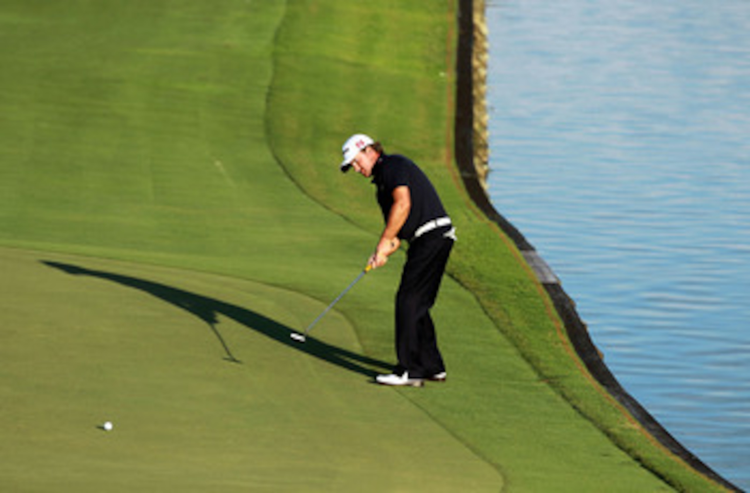 PONTE VEDRA BEACH, FL - MAY 15: Graeme McDowell of Northern Ireland putts on the 18th hole during the final round of THE PLAYERS Championship held at THE PLAYERS Stadium course at TPC Sawgrass on May 15, 2011 in Ponte Vedra Beach, Florida. (Photo by Sco PONTE VEDRA BEACH, FL - MAY 15: Graeme McDowell of Northern Ireland putts on the 18th hole during the final round of THE PLAYERS Championship held at THE PLAYERS Stadium course at TPC Sawgrass on May 15, 2011 in Ponte Vedra Beach, Florida. (Photo by Sco