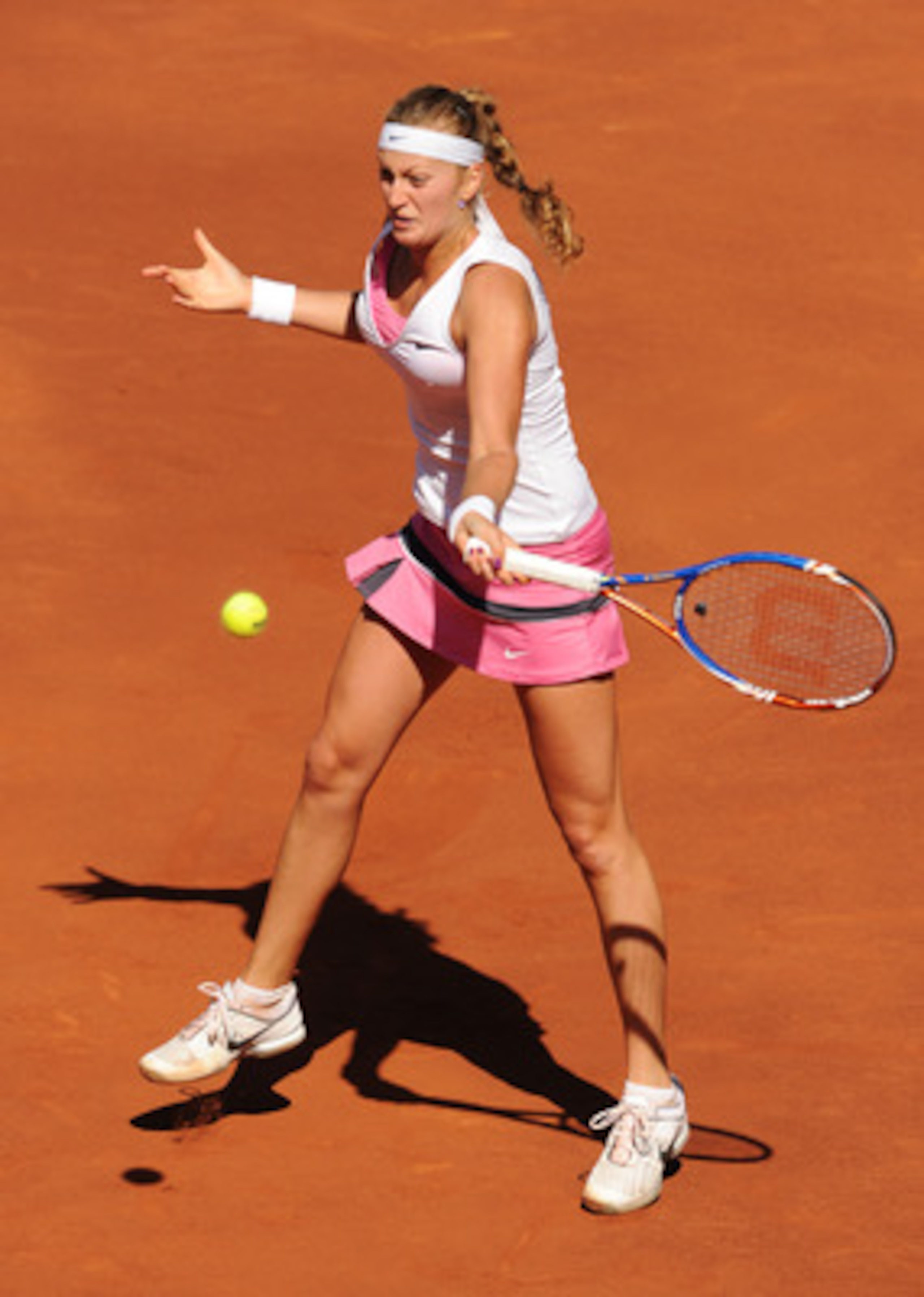 MADRID, SPAIN - MAY 08: Petra Kvitova of the Czech Republic plays a backhand to Victoria Azarenka of Belarus in her final match during day eight of the Mutua Madrilena Madrid Open Tennis on May 8, 2011 in Madrid, Spain. (Photo by Jasper Juinen/Getty Ima MADRID, SPAIN - MAY 08: Petra Kvitova of the Czech Republic plays a backhand to Victoria Azarenka of Belarus in her final match during day eight of the Mutua Madrilena Madrid Open Tennis on May 8, 2011 in Madrid, Spain. (Photo by Jasper Juinen/Getty Ima