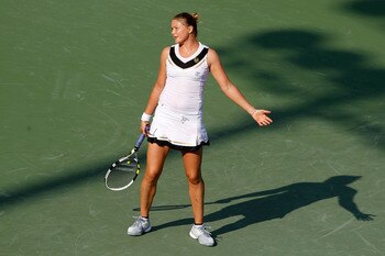 KEY BISCAYNE, FL - MARCH 25:  Dinara Safina of Russia reacts against Vera Zvonareva of Russia during the Sony Ericsson Open at Crandon Park Tennis Center on March 25, 2011 in Key Biscayne, Florida.  (Photo by Matthew Stockman/Getty Images)