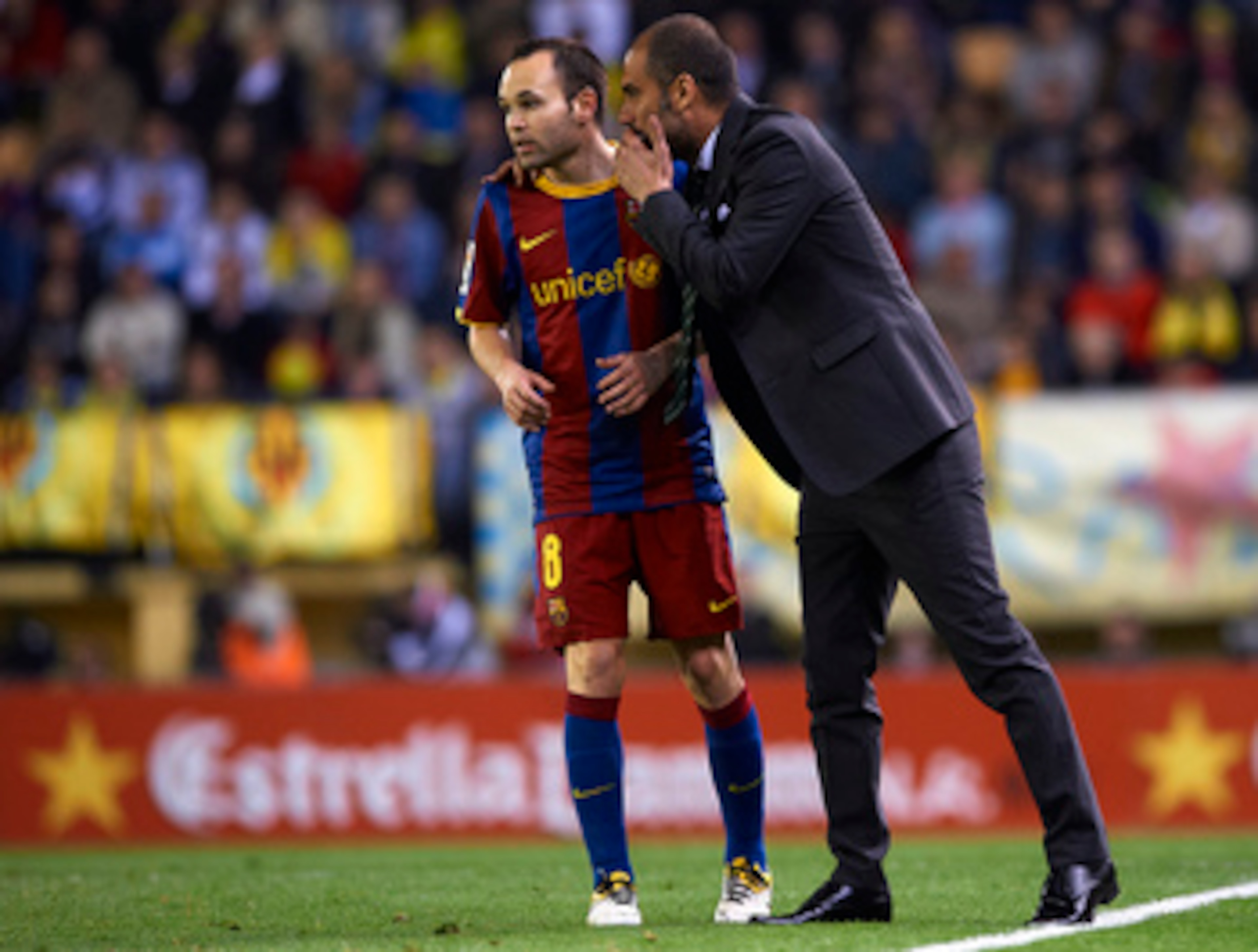 VILLARREAL, CASTELLON - APRIL 02:  Head Coach Josep Guardiola of Barcelona    give instructions to Andres Iniesta during the La Liga match between Villarreal and Barcelona at El Madrigal on April 2, 2011 in Villarreal, Spain.  (Photo by Manuel Queimadelos