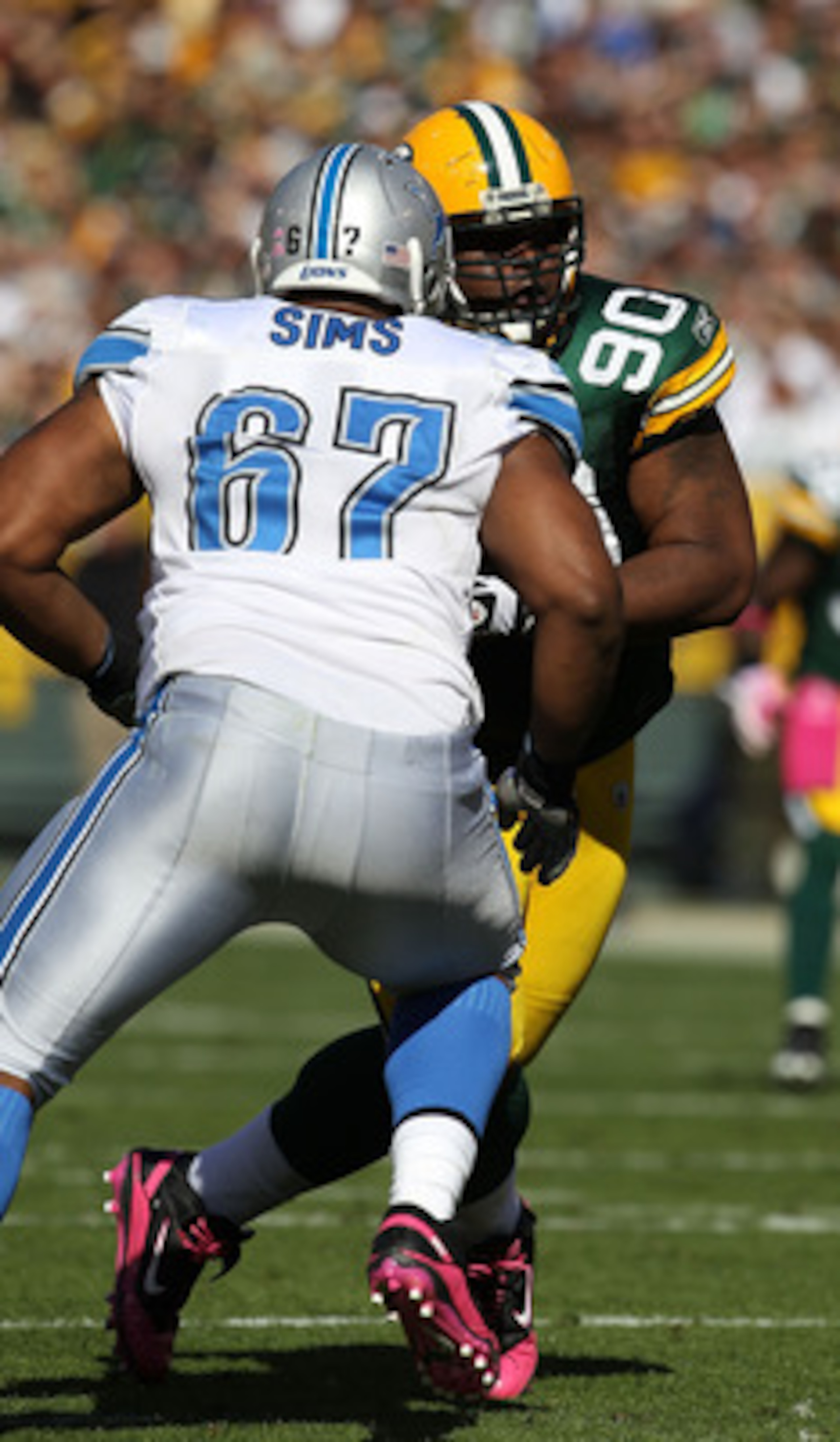 GREEN BAY, WI - OCTOBER 03: B.J. Raji #90 of the Green Bay Packers rushes against Rob Sims #67 of the Detroit Lions at Lambeau Field on October 3, 2010 in Green Bay, Wisconsin. The Packers defeated the Lions 28-26. (Photo by Jonathan Daniel/Getty Images)