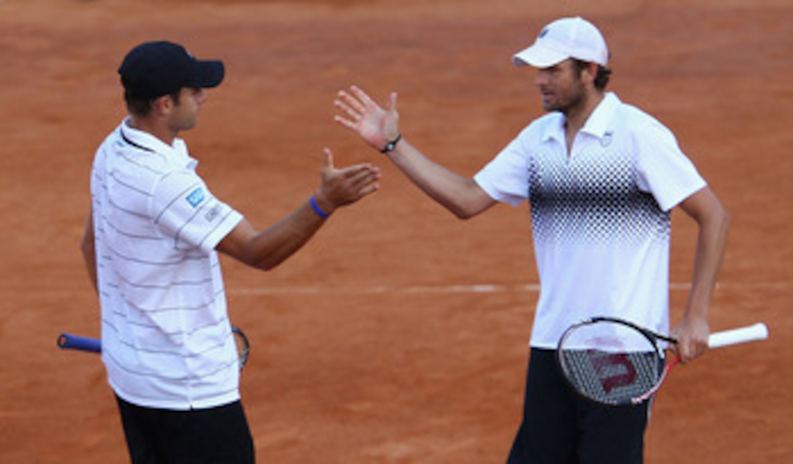 ROME, ITALY - MAY 14: Andy Roddick and Mardy Fish of the USA celebrate victory in their doubles semi final match against Carlos Berlocq of Argentina and Jarkko Nieminen of Finland during day seven of the Internazoinali BNL D'Italia at the Foro Italico Te ROME, ITALY - MAY 14: Andy Roddick and Mardy Fish of the USA celebrate victory in their doubles semi final match against Carlos Berlocq of Argentina and Jarkko Nieminen of Finland during day seven of the Internazoinali BNL D'Italia at the Foro Italico Te