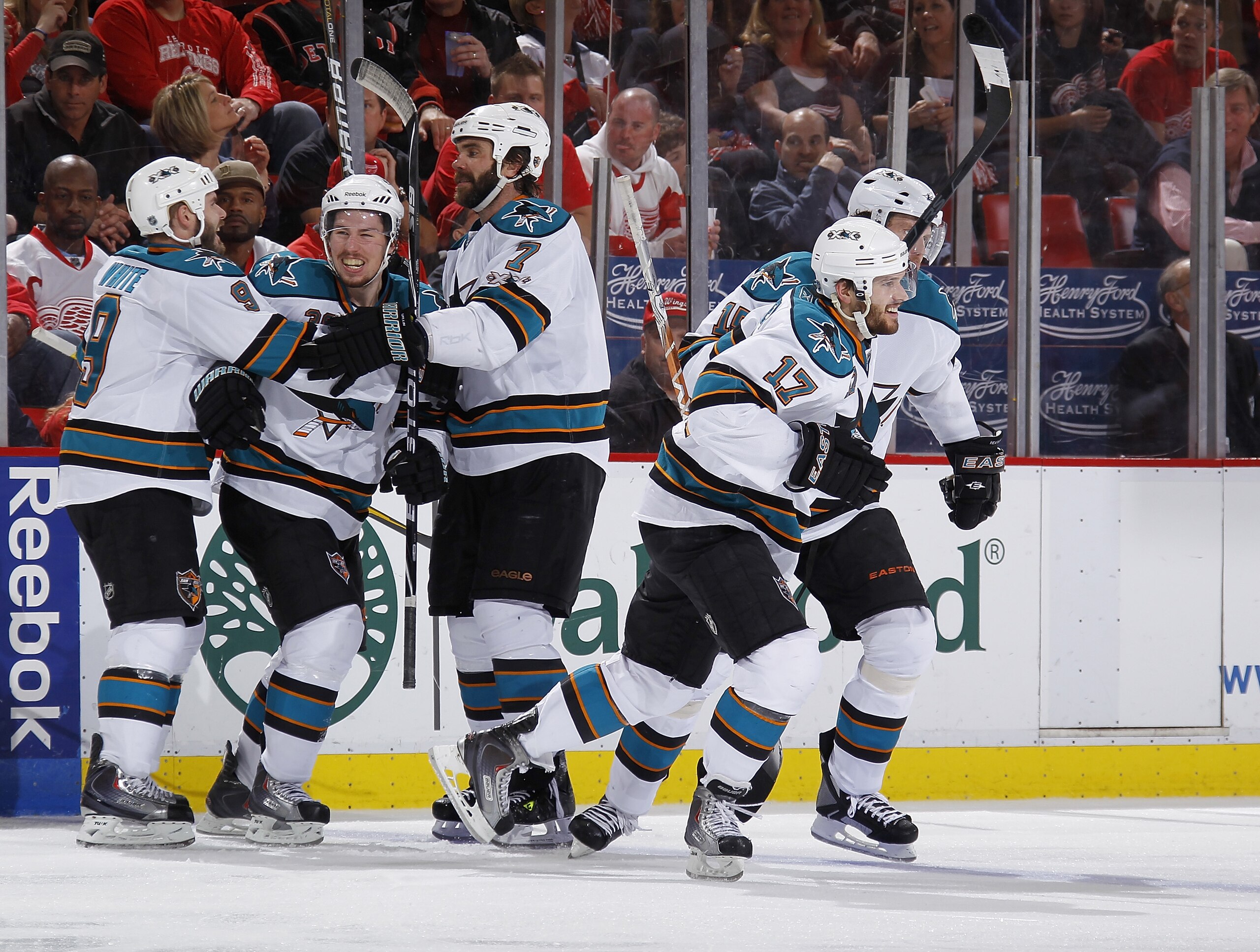DETROIT - MAY 10: Logan Couture #39 of the San Jose Sharks scores a third period goal and celebrates with teammates Torrey Mitchell #17, Niclas Wallin #7, Ian White #9, and Dany Heatley #15 while playing against the Detroit Red Wings in Game Six of the We