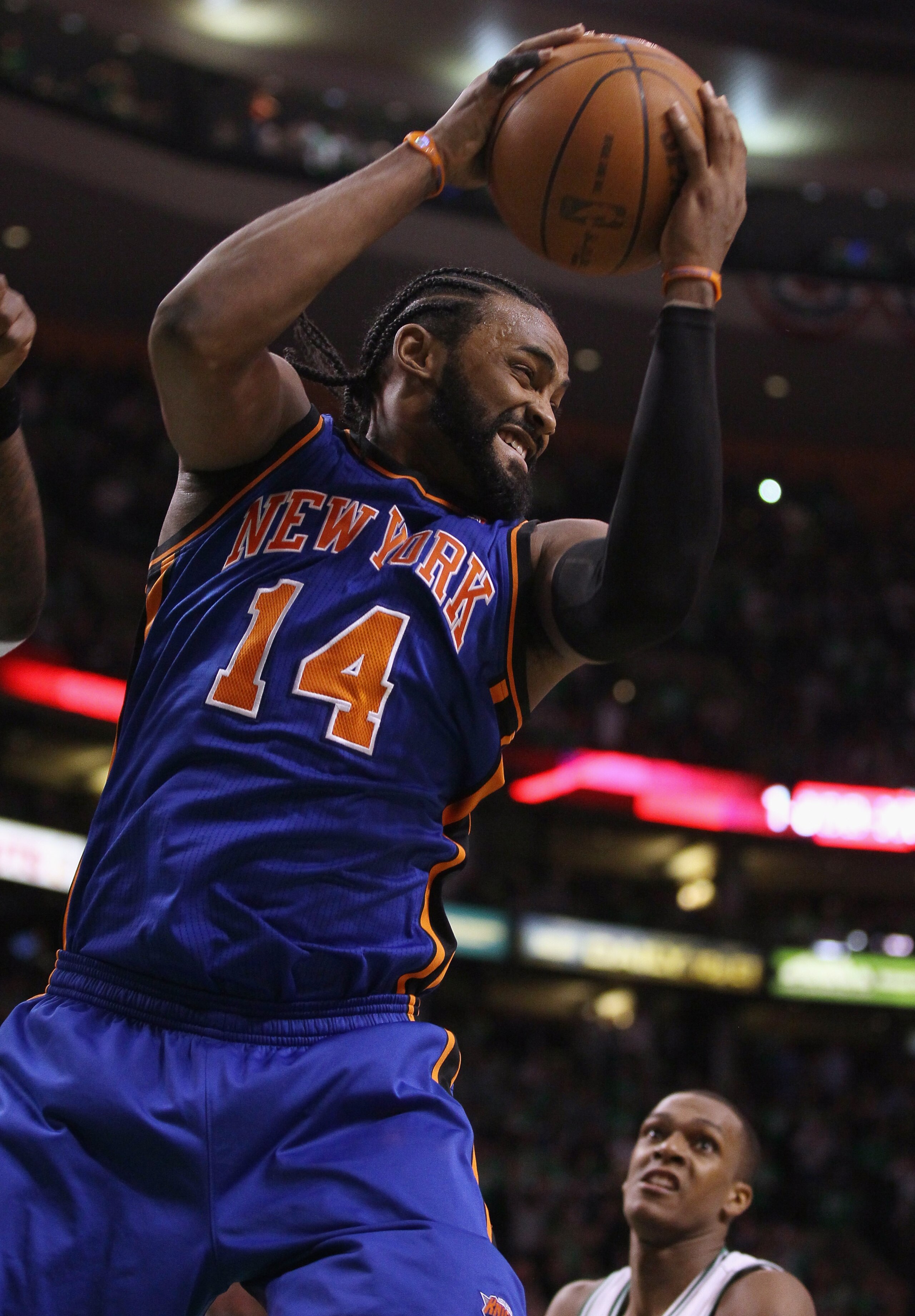 BOSTON, MA - APRIL 17: Ronny Turiaf #14 of the New York Knicks grabs the rebound as Rajon Rondo #9 of the Boston Celtics defends in Game One of the Eastern Conference Quarterfinals in the 2011 NBA Playoffs on April 17, 2011 at the TD Garden in Boston, Ma BOSTON, MA - APRIL 17: Ronny Turiaf #14 of the New York Knicks grabs the rebound as Rajon Rondo #9 of the Boston Celtics defends in Game One of the Eastern Conference Quarterfinals in the 2011 NBA Playoffs on April 17, 2011 at the TD Garden in Boston, Ma