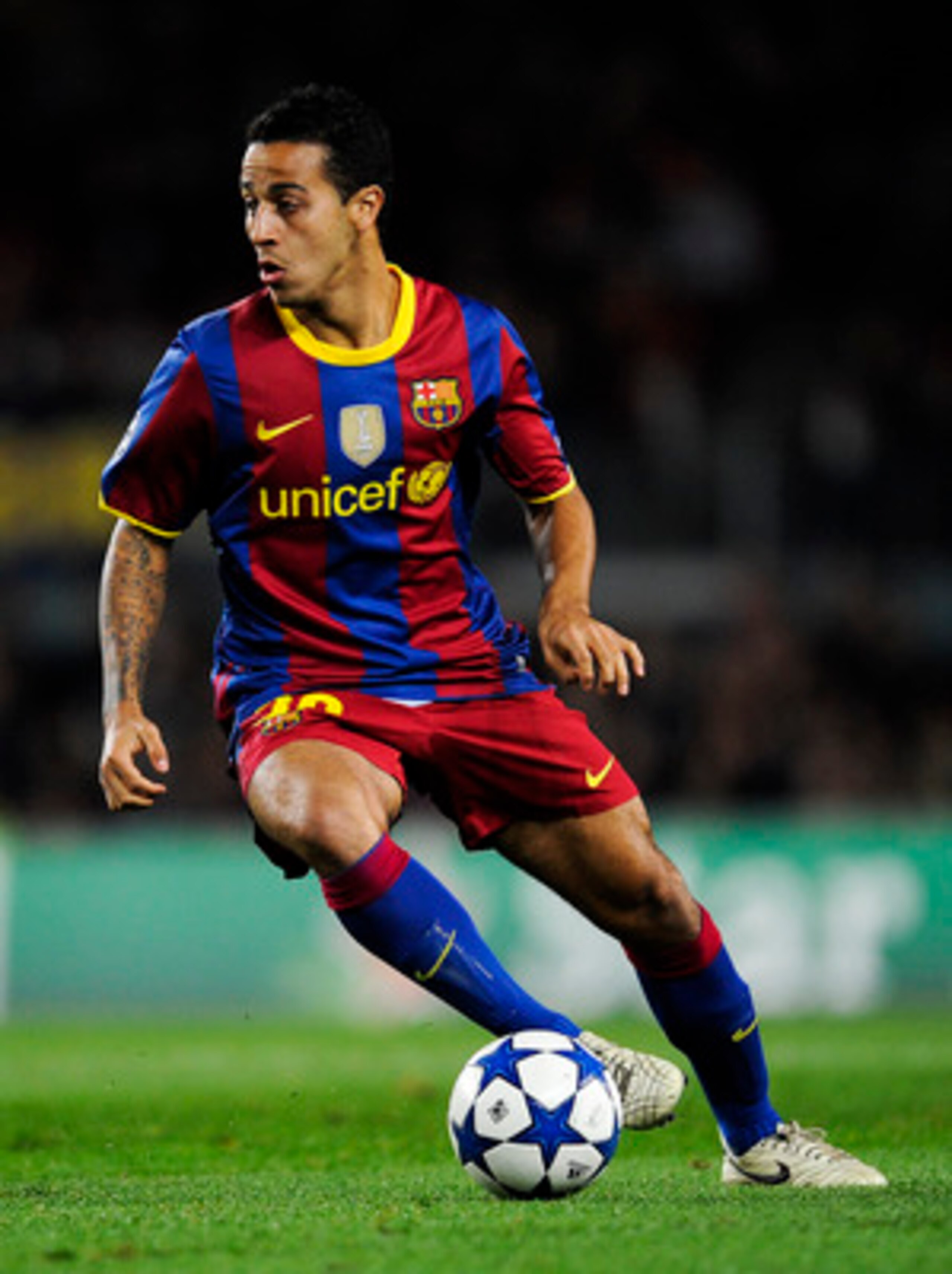 BARCELONA, SPAIN - DECEMBER 07:  Thiago Alcantara of Barcelona runs with the ball during the Champions League match between Barcelona and Rubin Kazan at Camp Nou Stadium on December 7, 2010 in Barcelona, Spain. Barcelona won 2-0.  (Photo by David Ramos/Ge