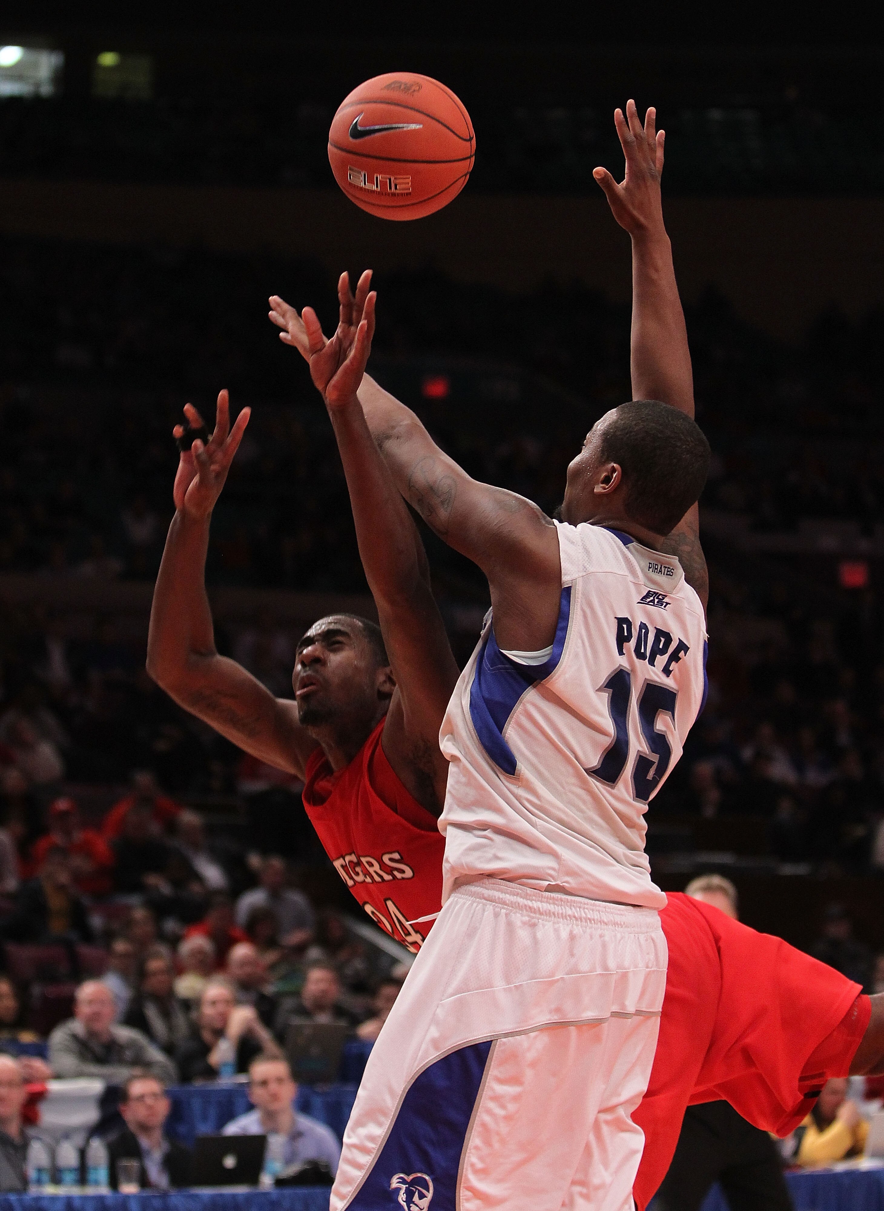 NEW YORK, NY - MARCH 08: Herb Pope #15 of the Seton Hall Pirates fouls Jonathan Mitchell #24 of the Rutgers Scarlet Knights at Madison Square Garden on March 8, 2011 in New York City.  (Photo by Nick Laham/Getty Images)
