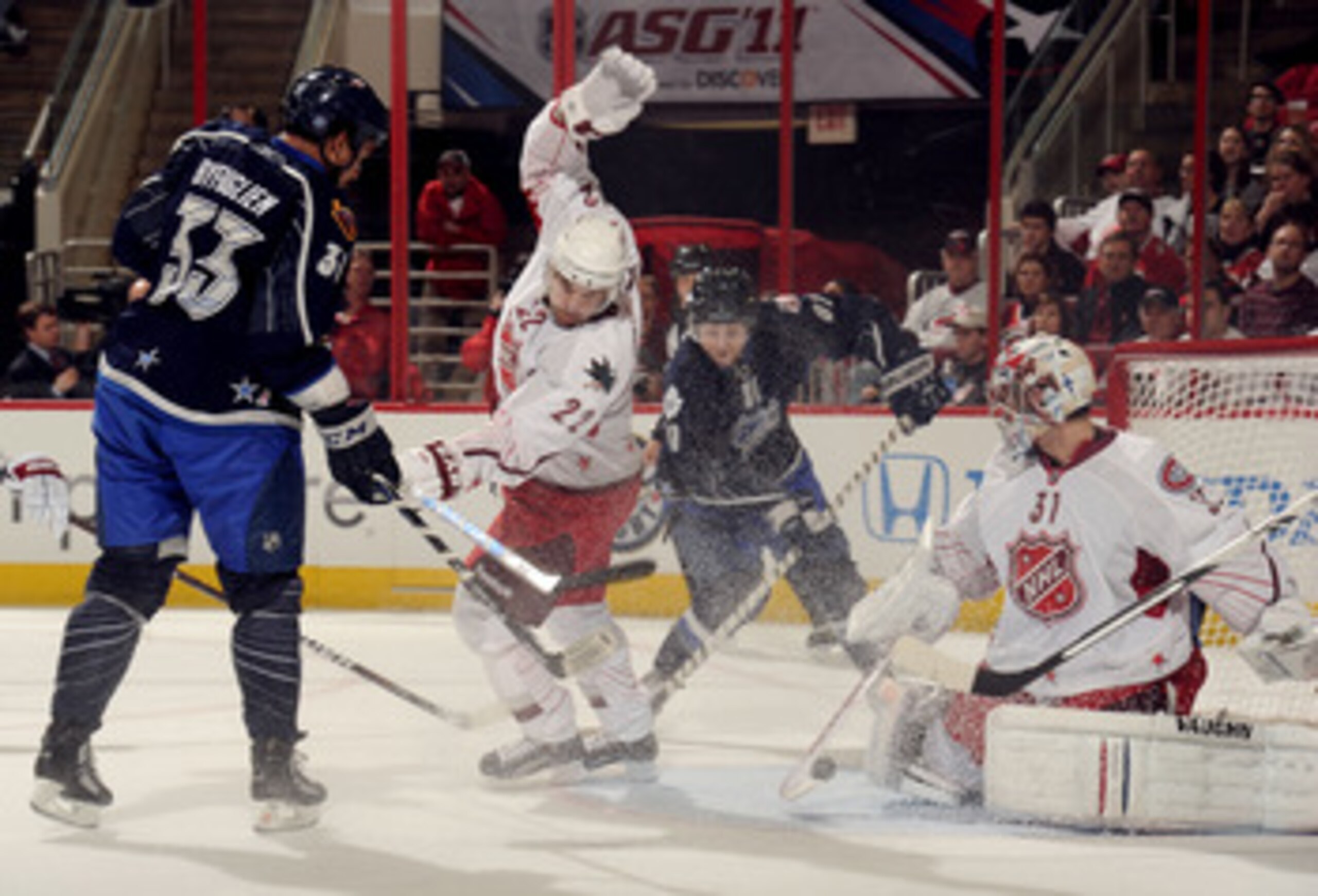 RALEIGH, NC - JANUARY 30:  Team Staal players Carey Price #31 of the Montreal Canadiens and Dan Boyle #22 of the San Jose Sharks defend against Team Lidstrom players Dustin Byfuglien #33 of the Atlanta Thrashers and Phil Kessel #81 of the Toronto Maple Le
