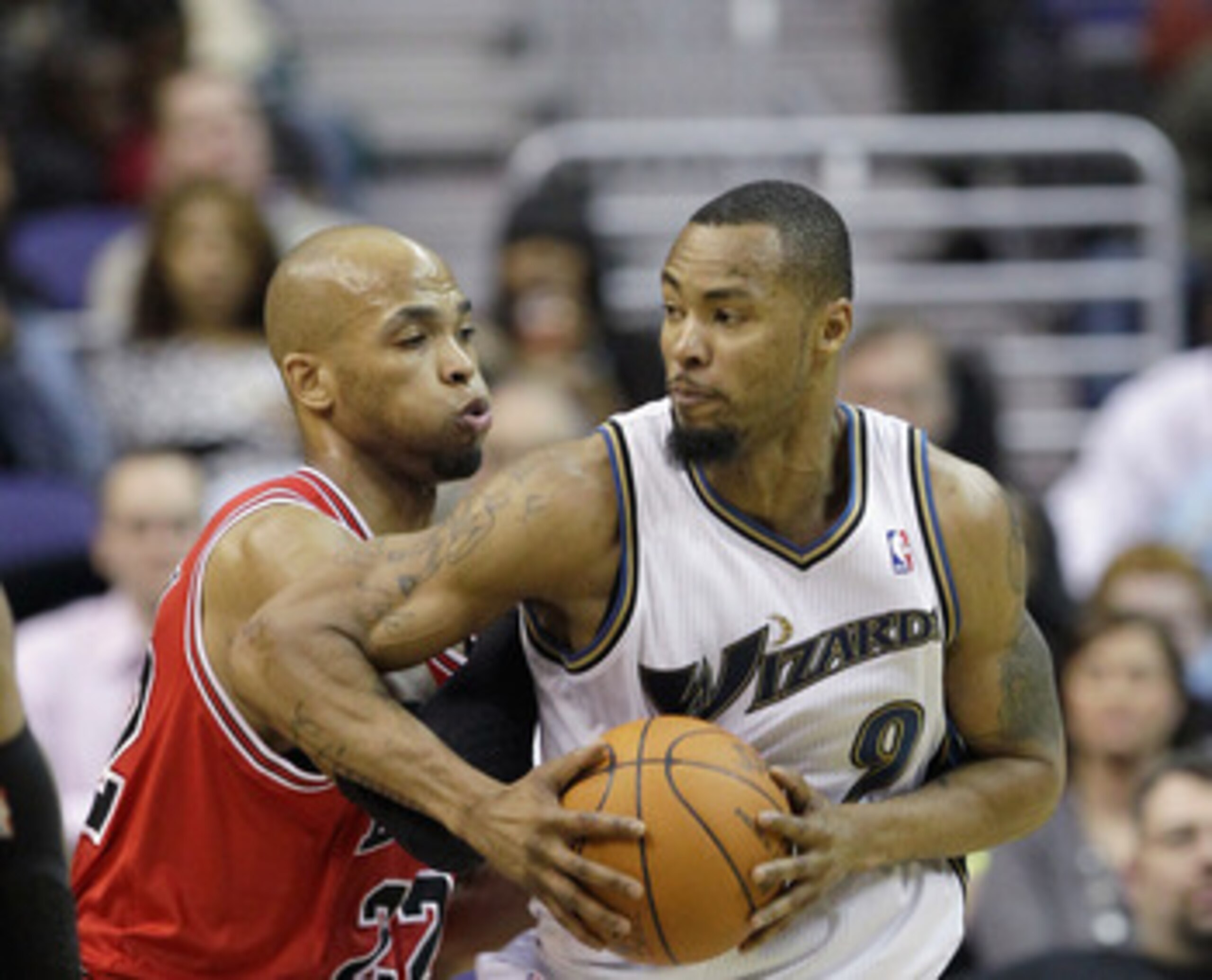 WASHINGTON, DC - FEBRUARY 28: Taj Gibson #22 of the Chicago Bulls guards Rashard Lewis #9 of the Washington Wizards at the Verizon Center in Washington on February 28, 2011 in Washington, DC. NOTE TO USER: User expressly acknowledges and agrees that, by d