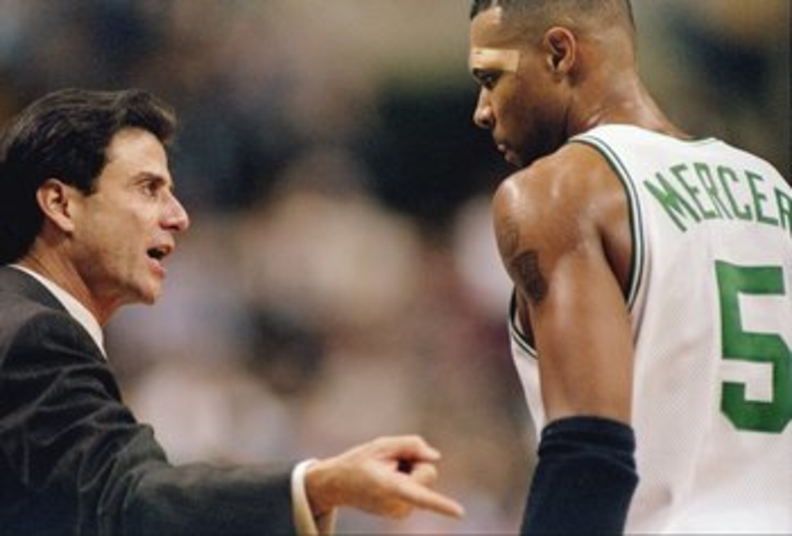 21 Nov 1997:  Head coach Rick Pitino of the Boston Celtics (left) talks to his guard Ron Mercer during a game against the New Jersey Nets at the Fleet Center in Boston, Massachusetts.  The Celtics won the game 101-93. Mandatory Credit: Jamie Squire  /Alls