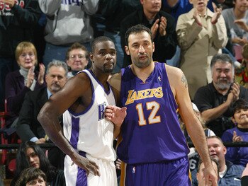 SACRAMENTO, CA - DECEMBER 16:  Chris Webber #4 of the Sacramento Kings and Vlade Divac #12 of the Los Angeles Lakers vie for position during their game on December 16, 2004 at Arco Arena  in Sacramento, California. The Lakers won 115-99. NOTE TO USER: Use