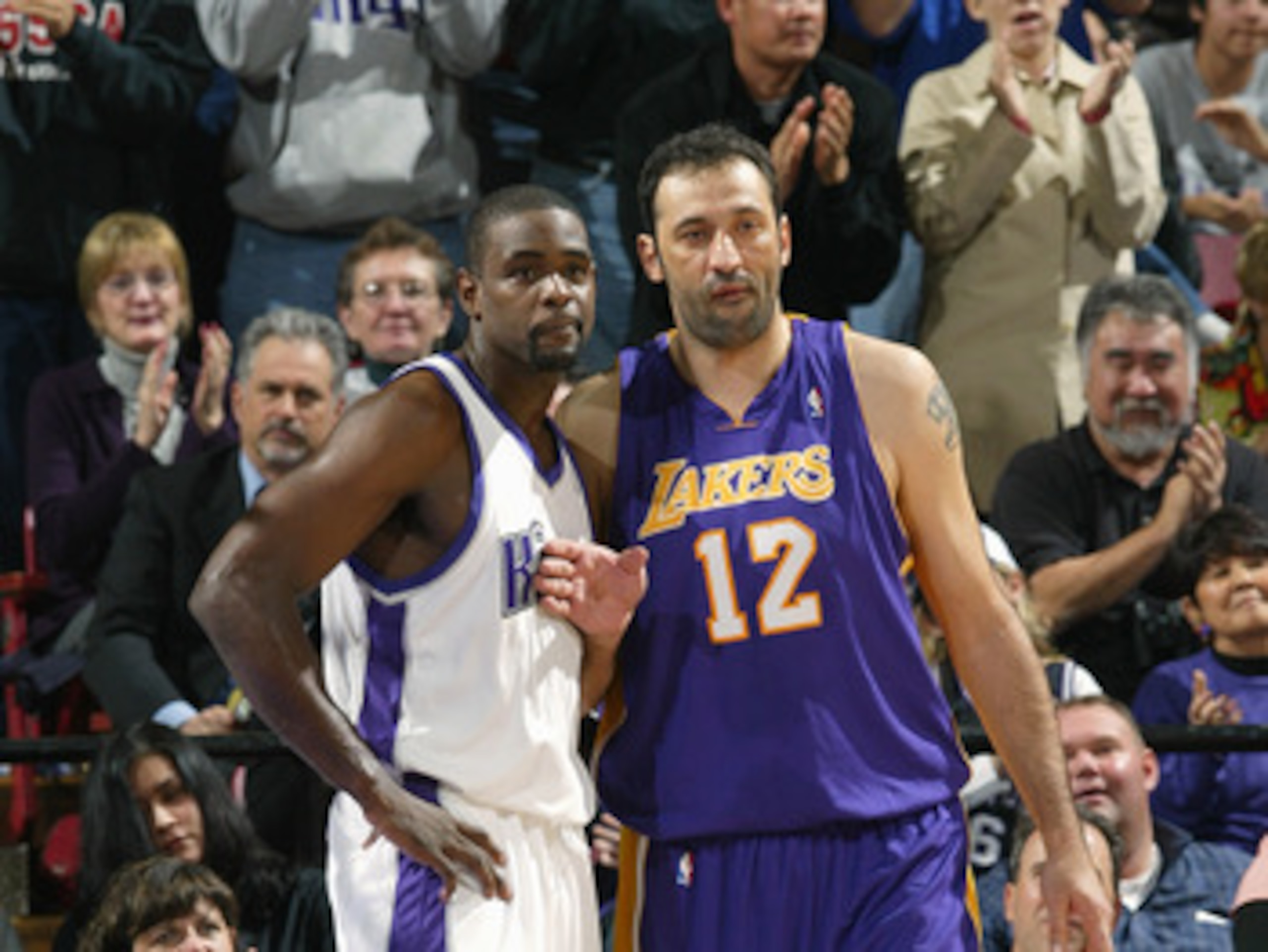 SACRAMENTO, CA - DECEMBER 16:  Chris Webber #4 of the Sacramento Kings and Vlade Divac #12 of the Los Angeles Lakers vie for position during their game on December 16, 2004 at Arco Arena  in Sacramento, California. The Lakers won 115-99. NOTE TO USER: Use