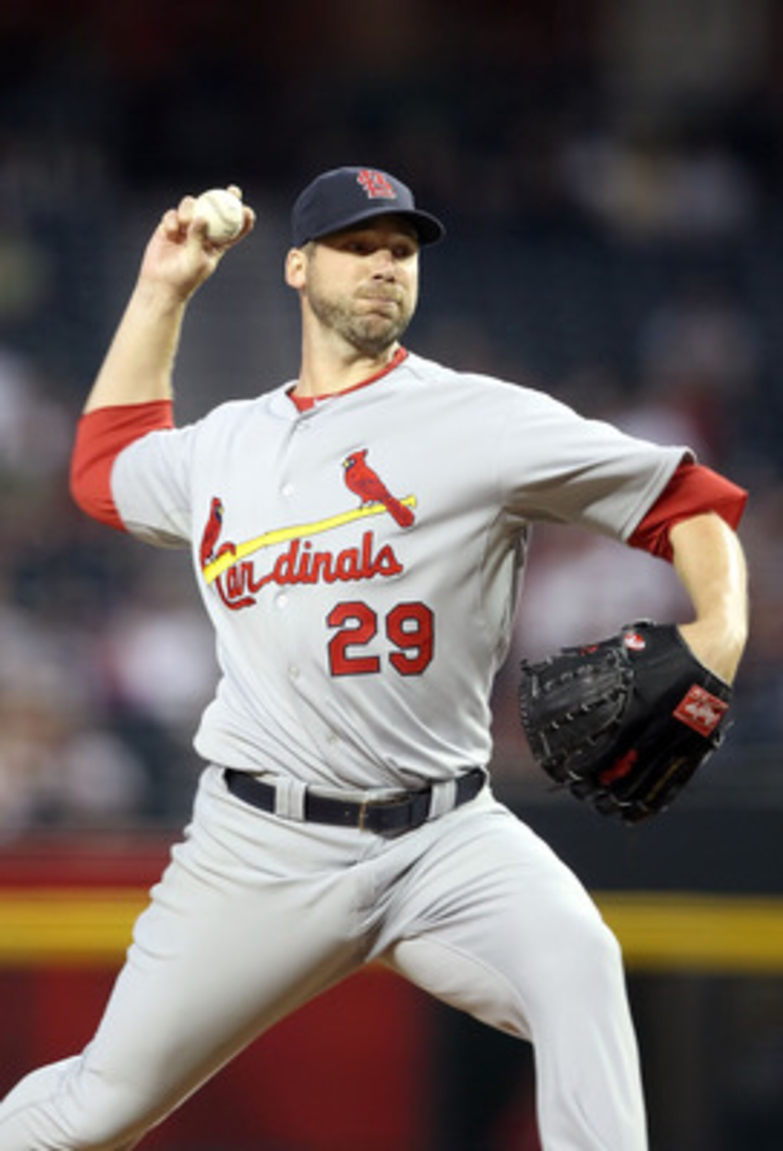 PHOENIX, AZ - APRIL 12:  Starting pitcher Chris Carpenter #29 of the St. Louis Cardinals pitches against the Arizona Diamondbacks during the Major League Baseball game at Chase Field on April 12, 2011 in Phoenix, Arizona. The Diamondbacks defeated the Car
