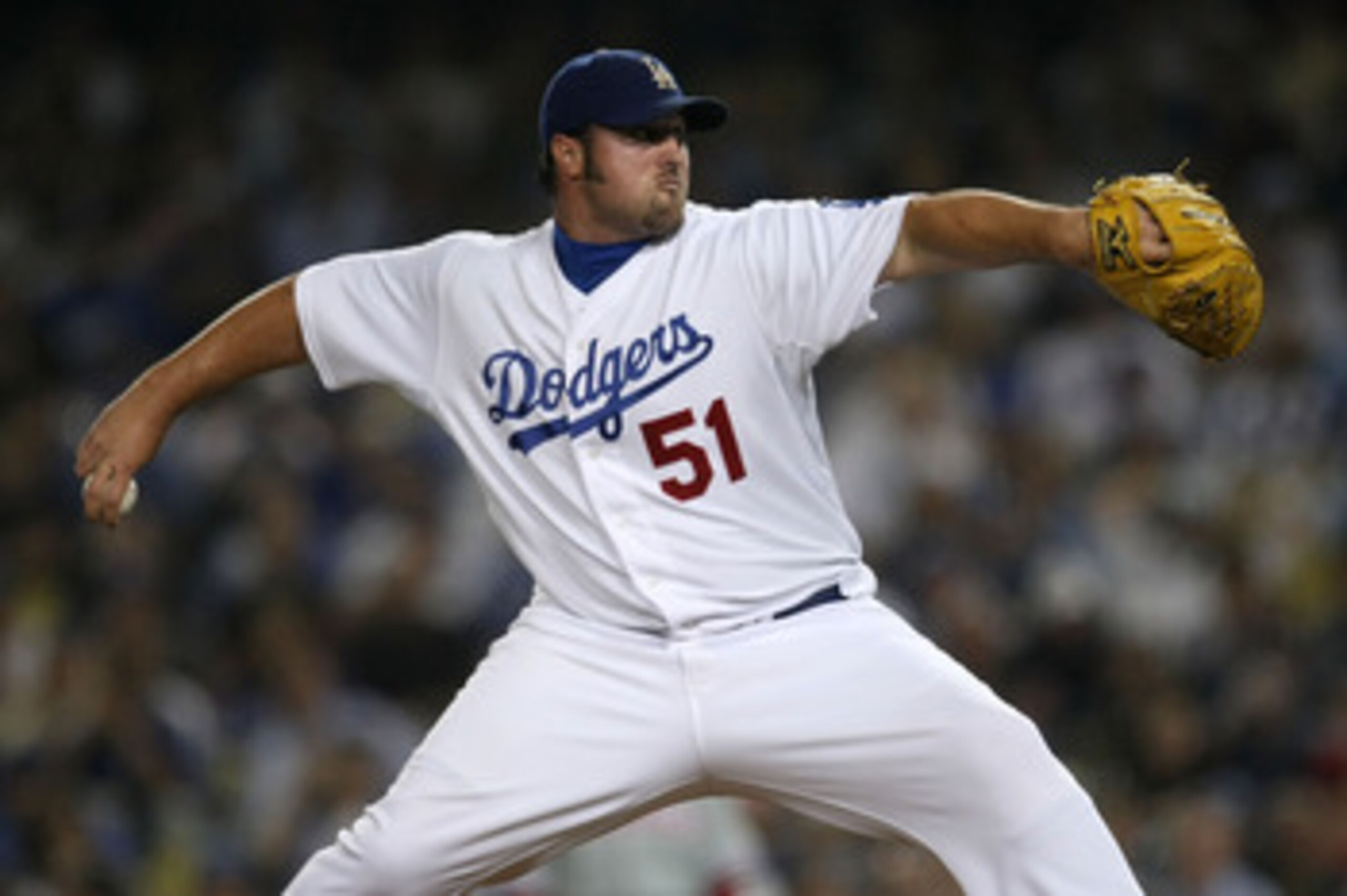LOS ANGELES, CA - OCTOBER 15:  Pitcher Jonathan Broxton #51 of the Los Angeles Dodgers delivers a pitch in the ninth inning against the Philadelphia Phillies in Game One of the NLCS during the 2009 MLB Playoffs at Dodger Stadium on October 15, 2009 in Los