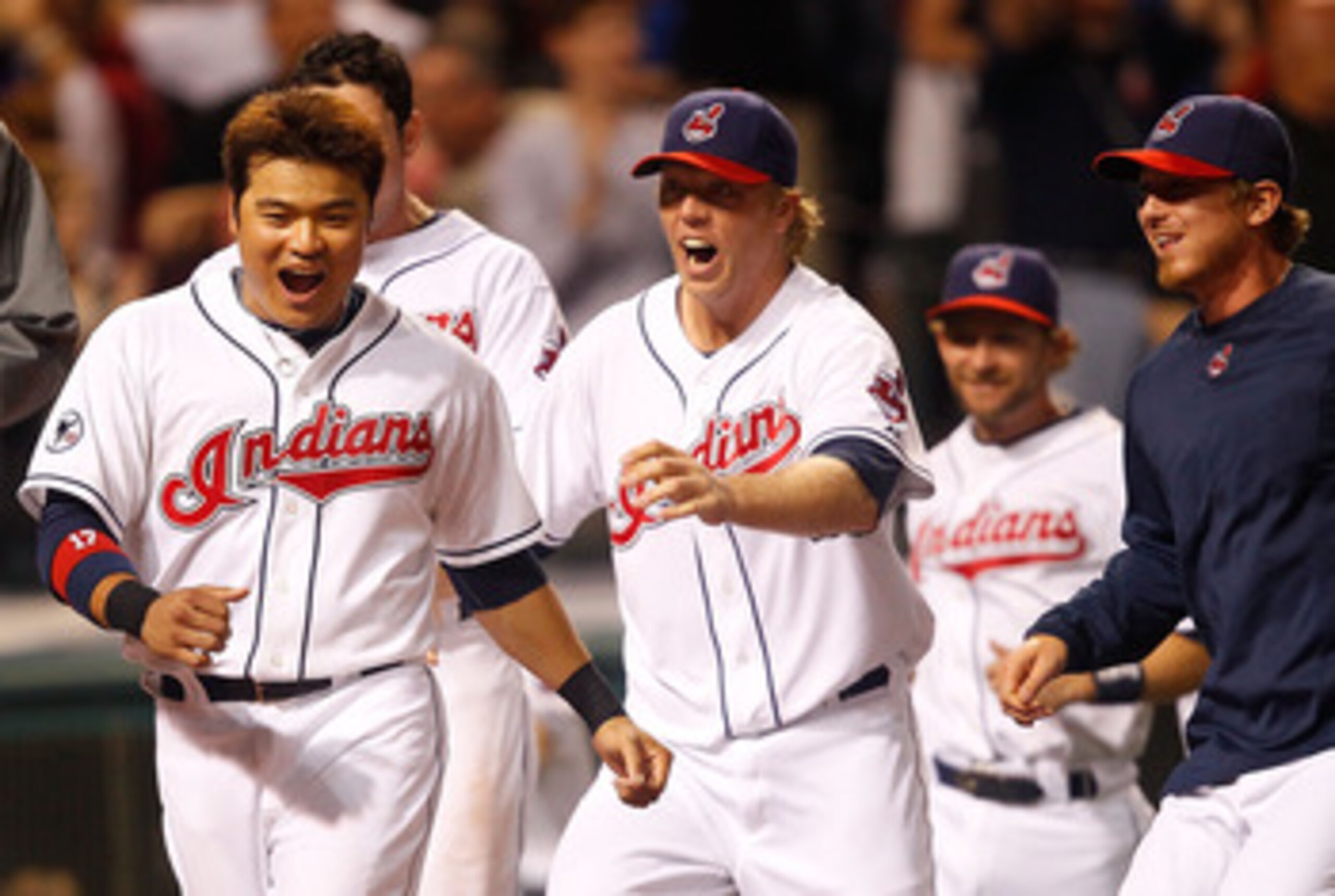 CLEVELAND - MAY 13:  Shin-Soo Choo #17 of the Cleveland Indians and members of his team celebrate following the walk-off two run home run by Travis Hafner #48 in the 9th inning against the Seattle Mariners during the game on May 13, 2011 at Progressive Fi