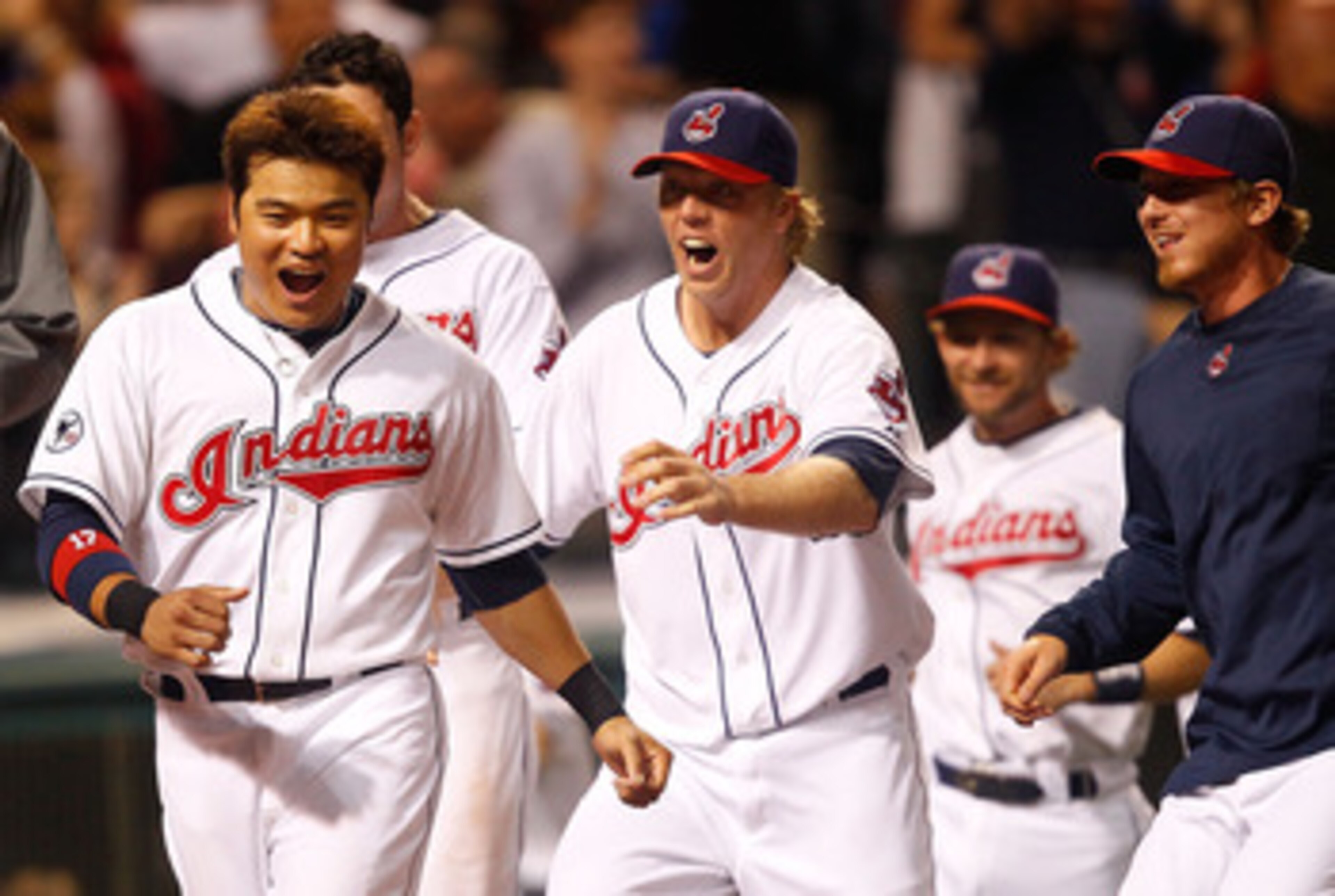 CLEVELAND - MAY 13:  Shin-Soo Choo #17 of the Cleveland Indians and members of his team celebrate following the walk-off two run home run by Travis Hafner #48 in the 9th inning against the Seattle Mariners during the game on May 13, 2011 at Progressive Fi