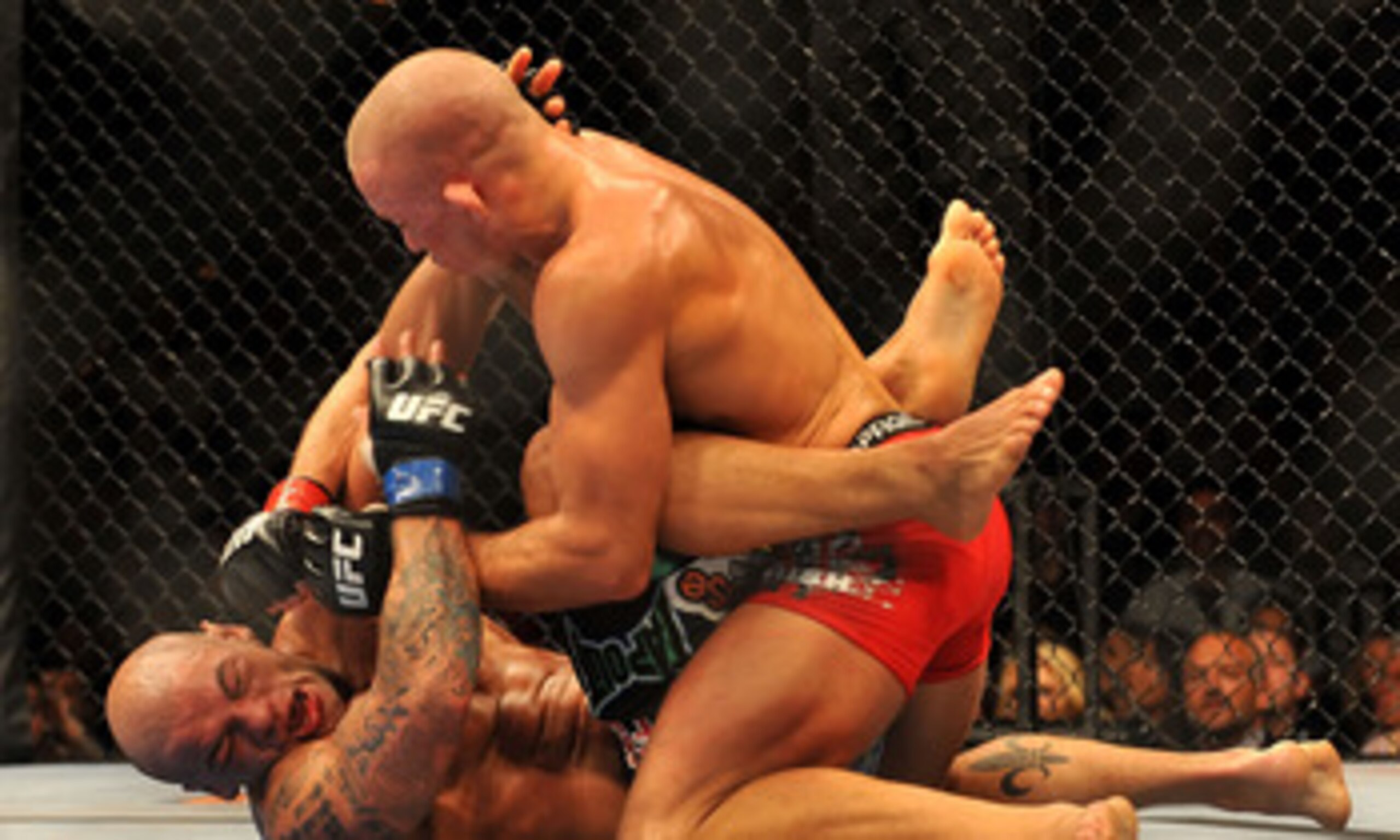 LAS VEGAS - JULY 11:  (Top) Georges St. Pierre battles Thiago Alves during their welterweight title bout during UFC 100 on July 11, 2009 in Las Vegas, Nevada.  (Photo by Jon Kopaloff/Getty Images)