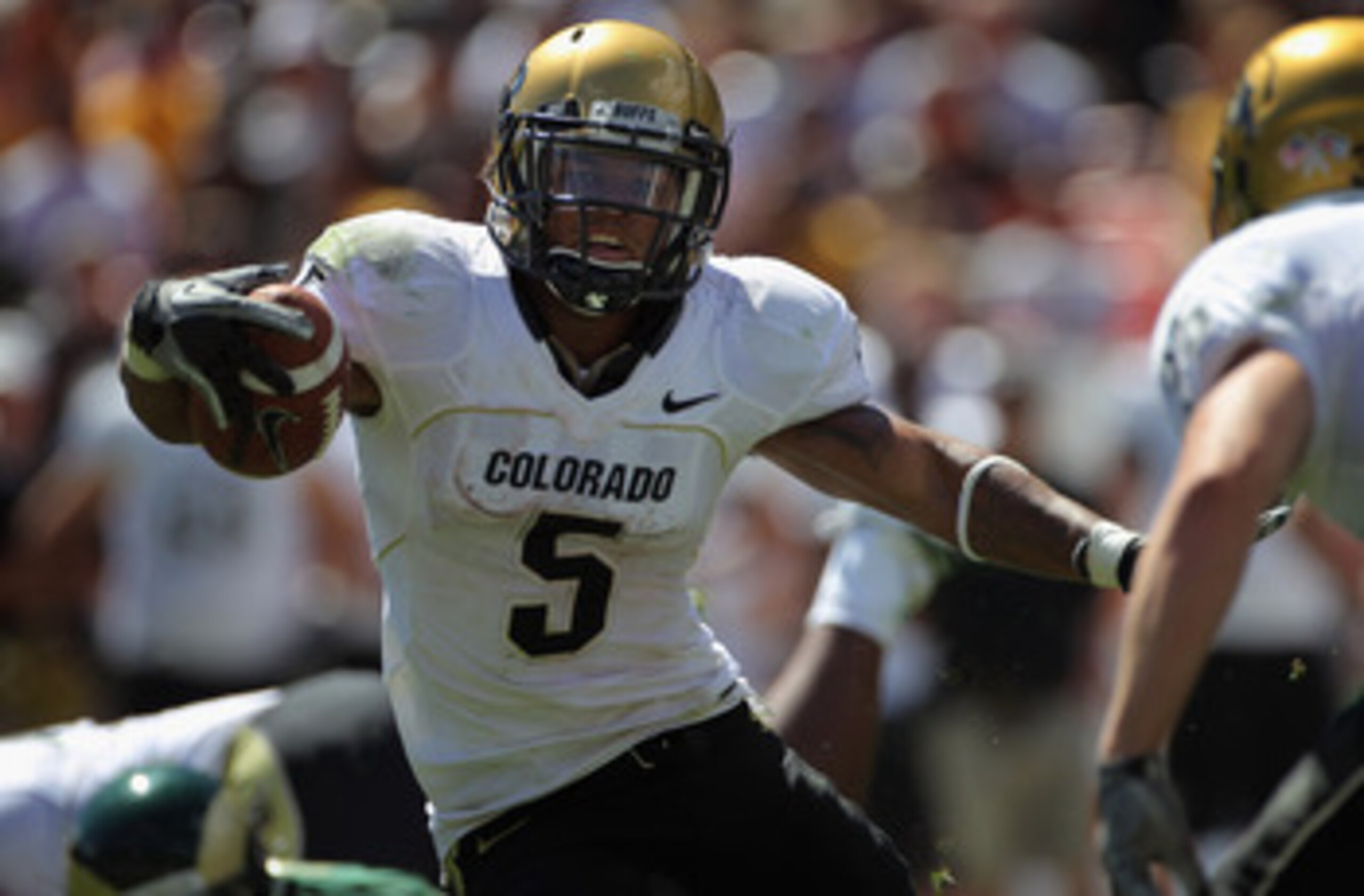 DENVER - SEPTEMBER 04: Running back Rodney Stewart #5 of the Colorado Buffaloes picks up yardage as he rushes against the Colorado State Rams during the the Rocky Mountain Showdown at INVESCO Field at Mile High on September 4, 2010 in Denver, Colorado. DENVER - SEPTEMBER 04: Running back Rodney Stewart #5 of the Colorado Buffaloes picks up yardage as he rushes against the Colorado State Rams during the the Rocky Mountain Showdown at INVESCO Field at Mile High on September 4, 2010 in Denver, Colorado.