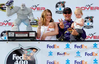 DOVER, DE - MAY 15:  Matt Kenseth (2R), driver of the #17 Wiley X Sunglasses Ford, his wife, Katie(L), and children, Kaylin and Grace Kenseth, pose in Victory Lane during the NASCAR Sprint Cup Series FedEx 400 Benefiting Autism Speaks at Dover Internation