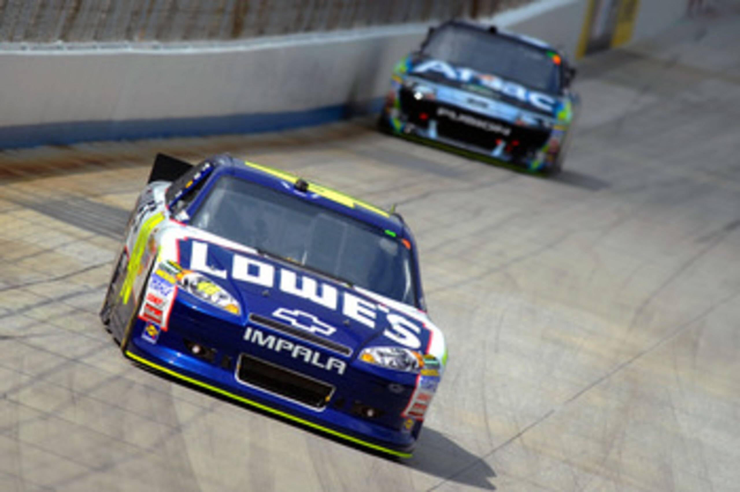 DOVER, DE - MAY 15: Jimmie Johnson, driver of the #48 Lowe's Chevrolet, leads Carl Edwards, driver of the #99 Aflac Ford, race during the NASCAR Sprint Cup Series FedEx 400 Benefiting Autism Speaks at Dover International Speedway on May 15, 2011 in Dover DOVER, DE - MAY 15: Jimmie Johnson, driver of the #48 Lowe's Chevrolet, leads Carl Edwards, driver of the #99 Aflac Ford, race during the NASCAR Sprint Cup Series FedEx 400 Benefiting Autism Speaks at Dover International Speedway on May 15, 2011 in Dover